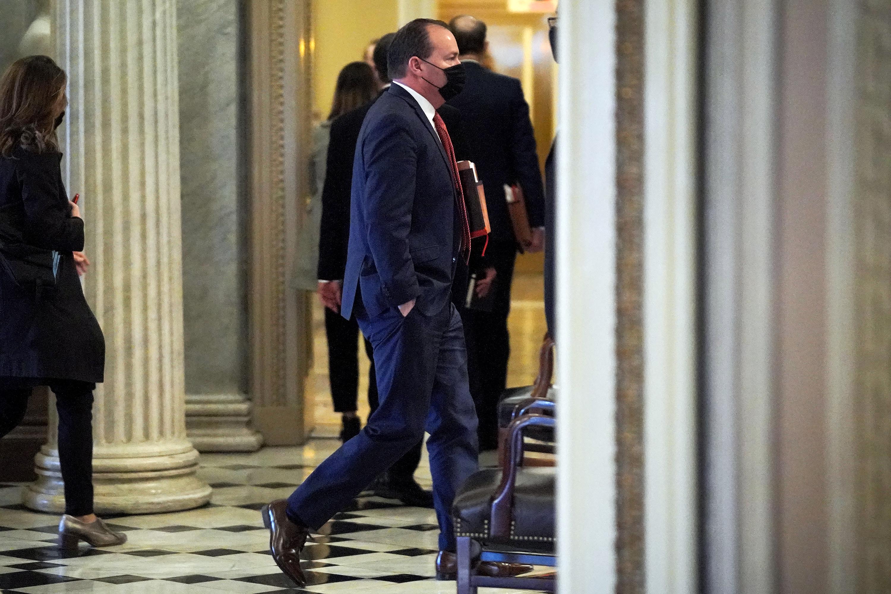 Sen. Mike Lee (R-UT) heads to the Senate Chamber before the fifth day of the Senate Impeachment trials on Saturday, February 13, 2021.