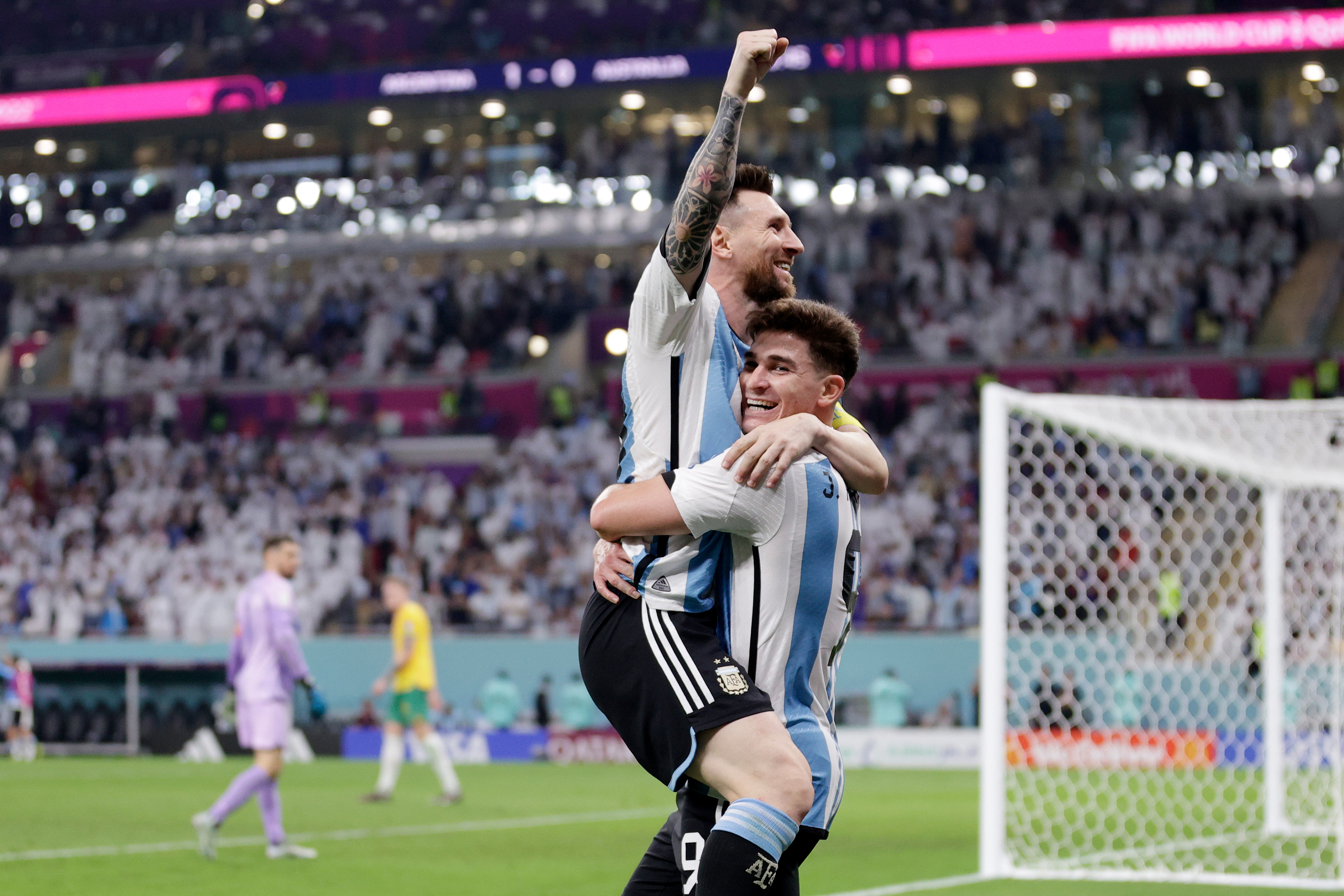 Julián Álvarez celebrates scoring Argentina's second goal with Lionel Messi in a match against Australia at the Ahmad bin Ali Stadium in Al Rayyan, Qatar on Saturday.