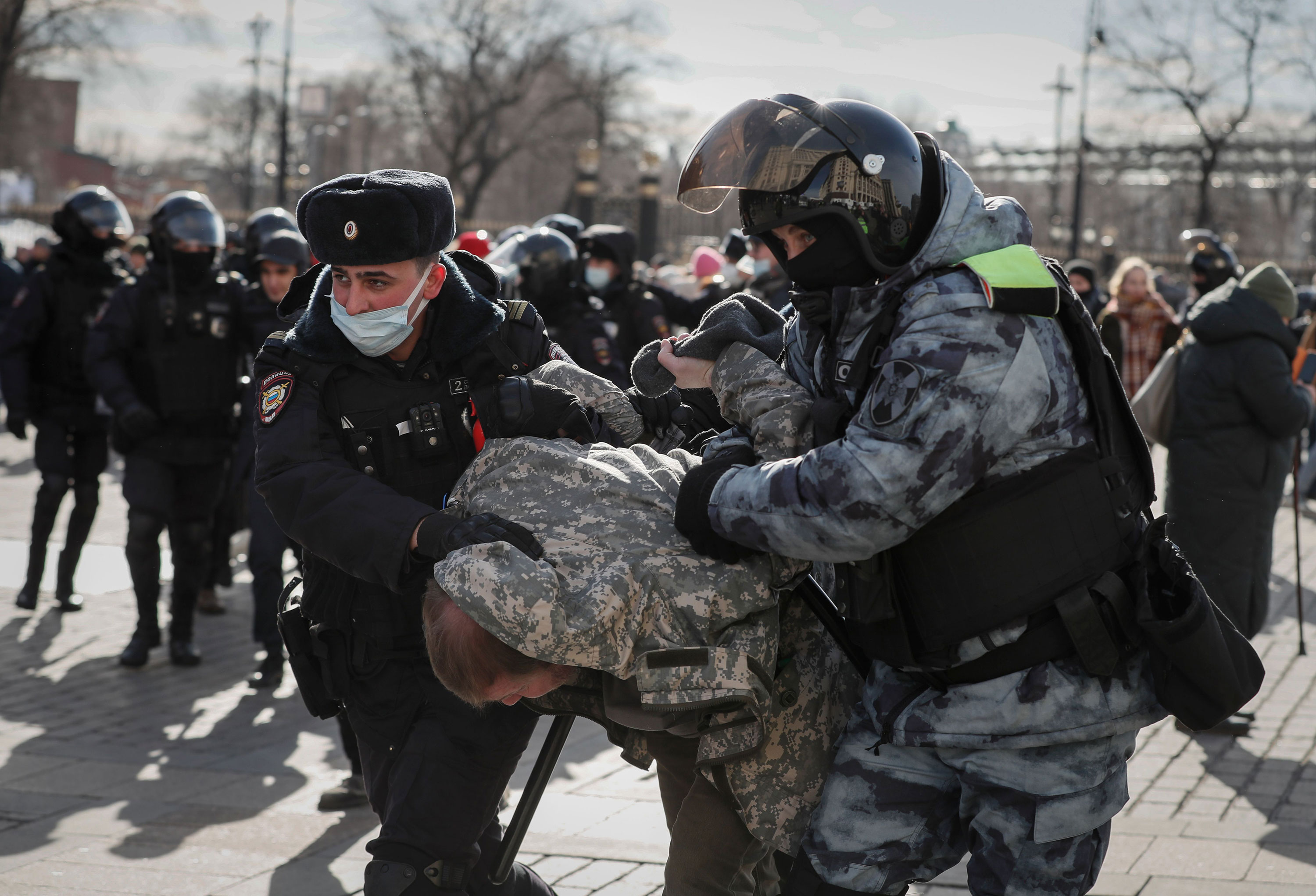 Russian police detain a protester in Moscow on March 6.