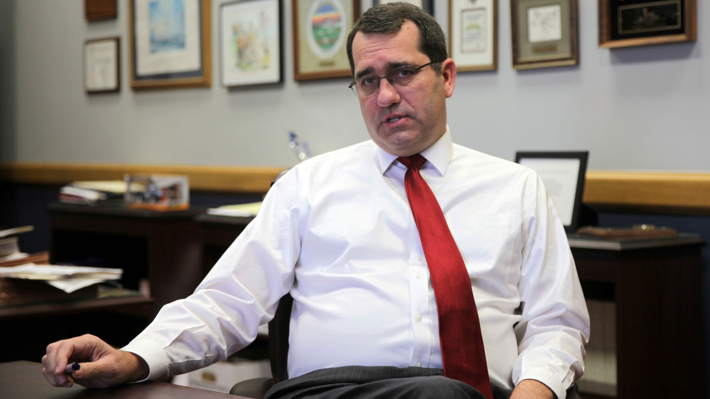Kansas Attorney General Derek Schmidt answers questions in his office in Topeka in December.