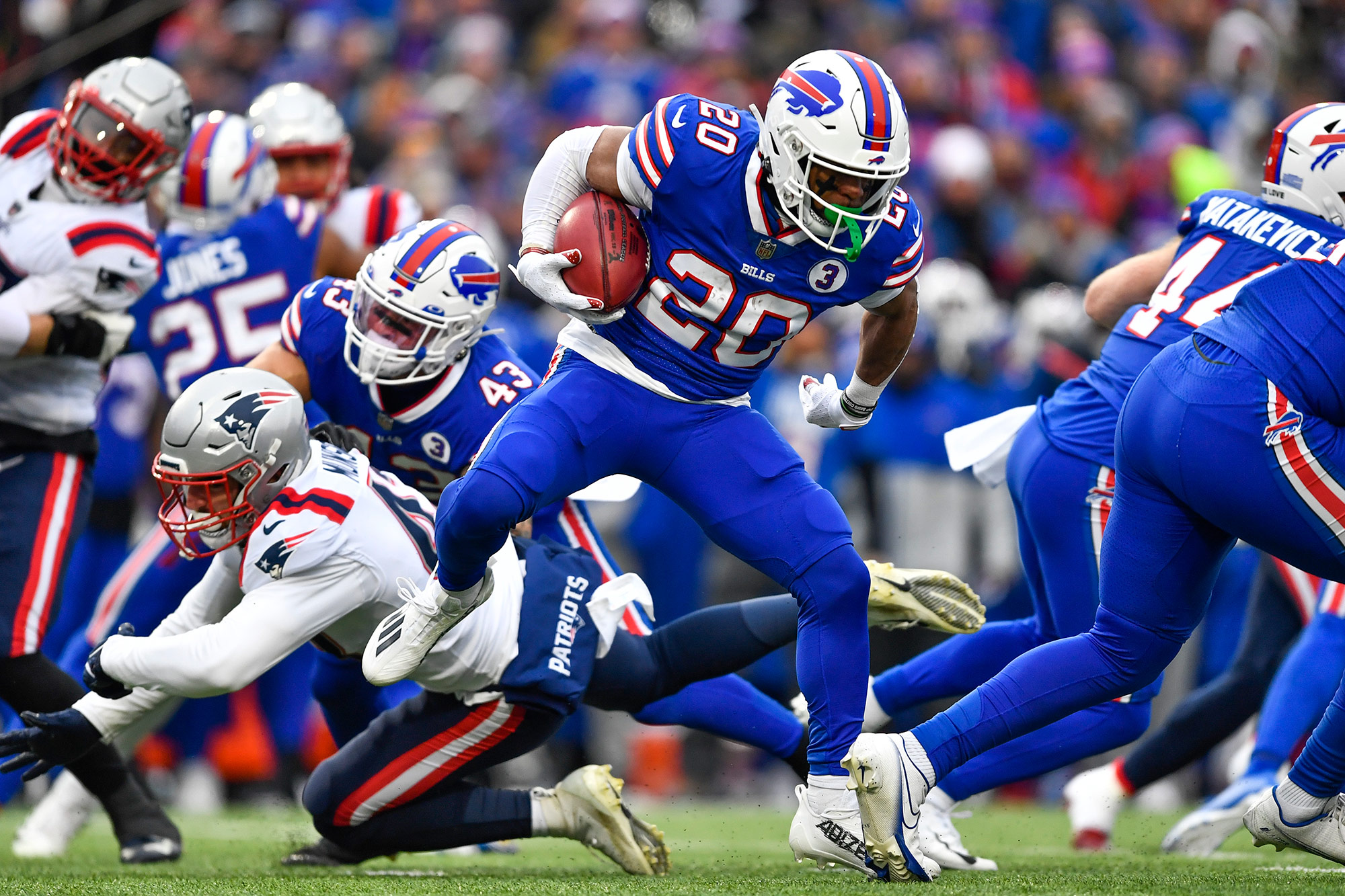 Buffalo Bills running back Nyheim Hines scores a touchdown on a kickoff return in the first half of Sunday's game against the New England Patriots. 