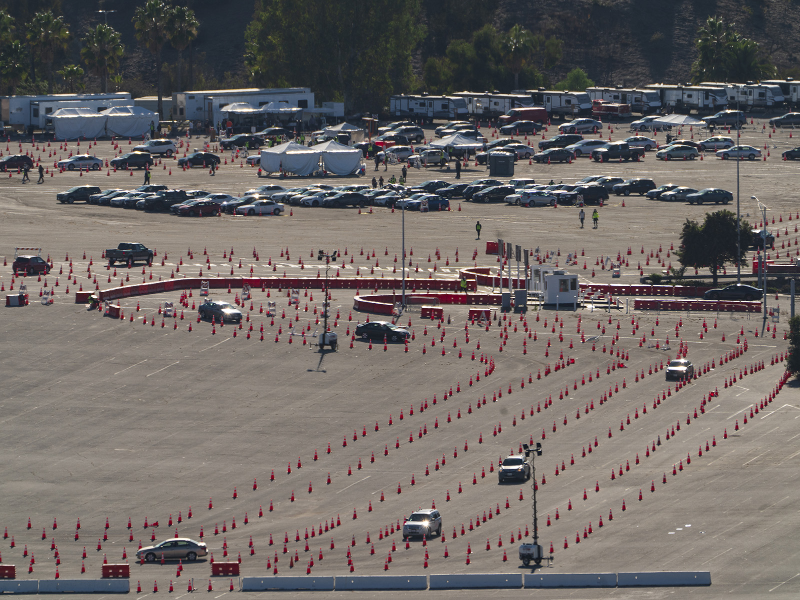 Motorists queue up to take a coronavirus test in a parking lot at Dodger Stadium's drive-thru testing site in Los Angeles Monday, January 11.