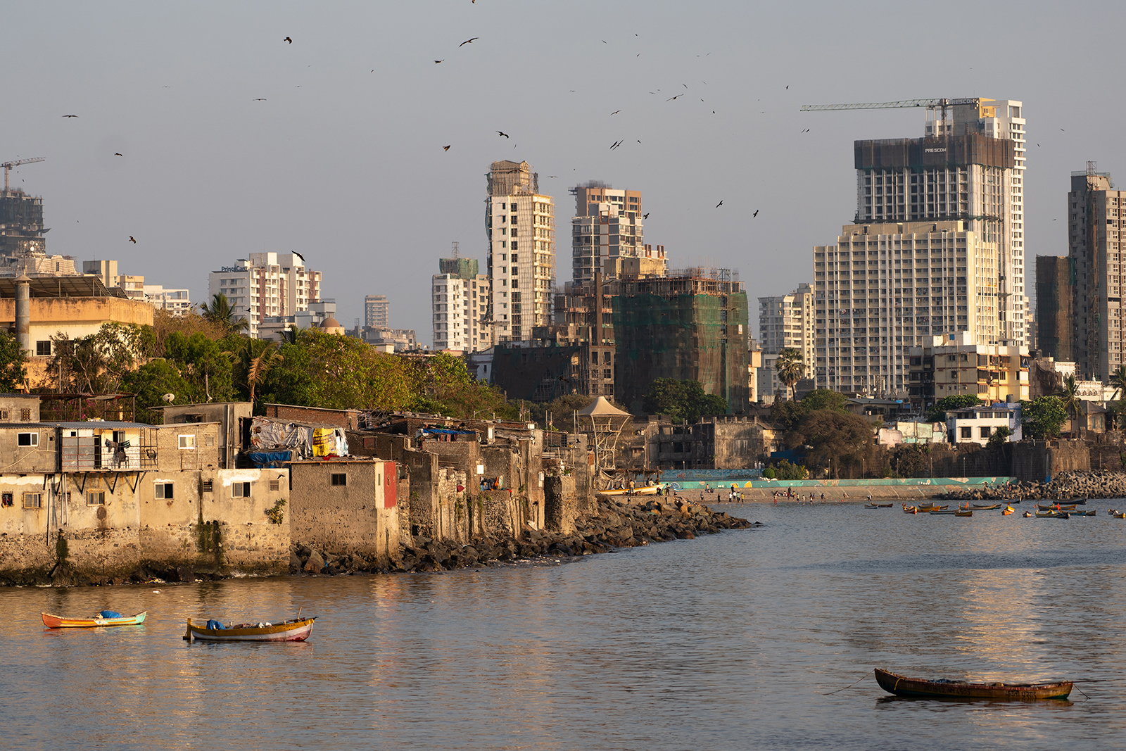 Slums are seen near commercial high-rise buildings in Mumbai, India, on April 14.