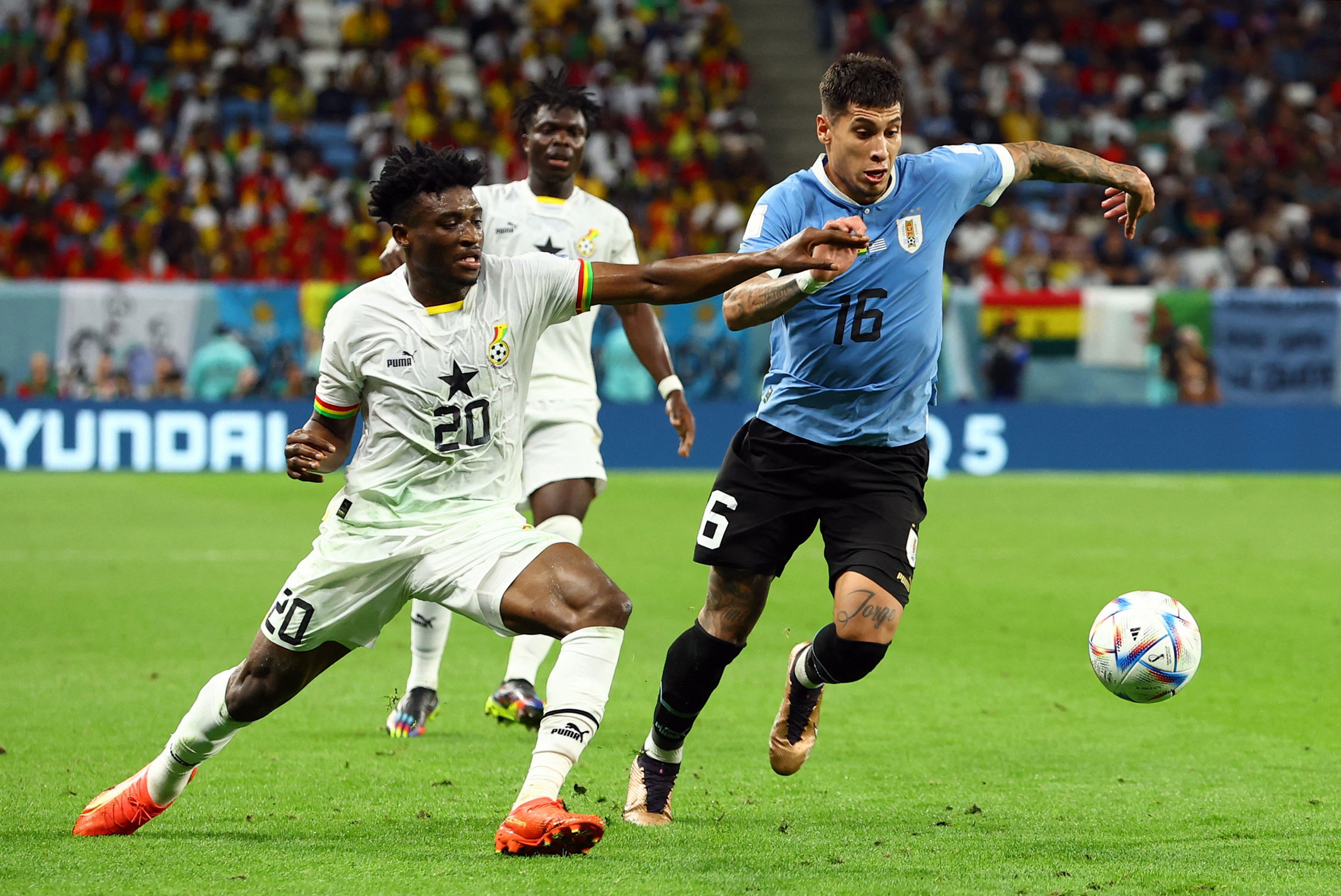 Uruguay's Mathias Olivera, right, in action with Ghana's Mohammed Kudus on Friday.