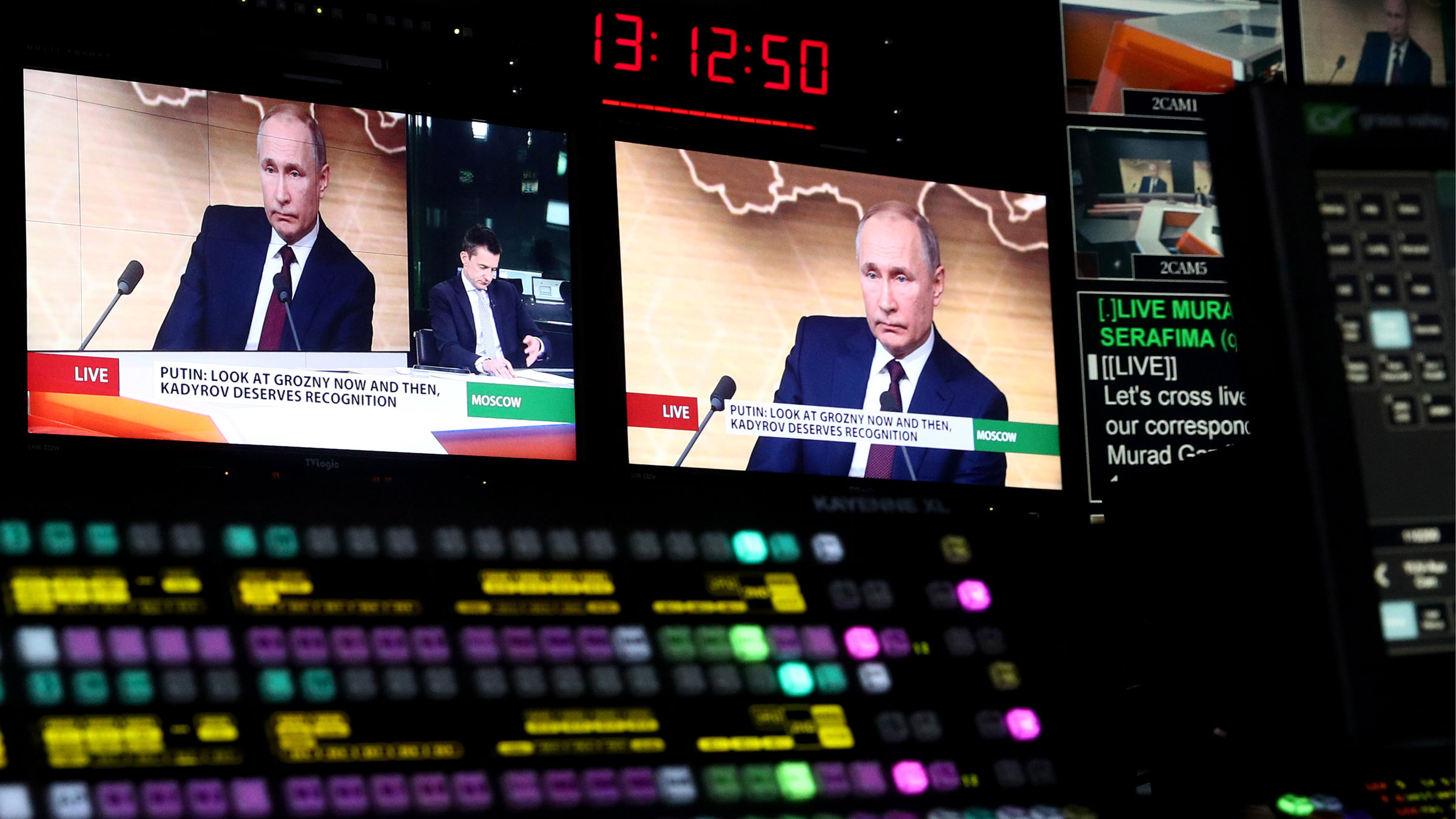 A news conference by Russian President Vladimir Putin is seen from a Russia Today production studio in Moscow in 2019.