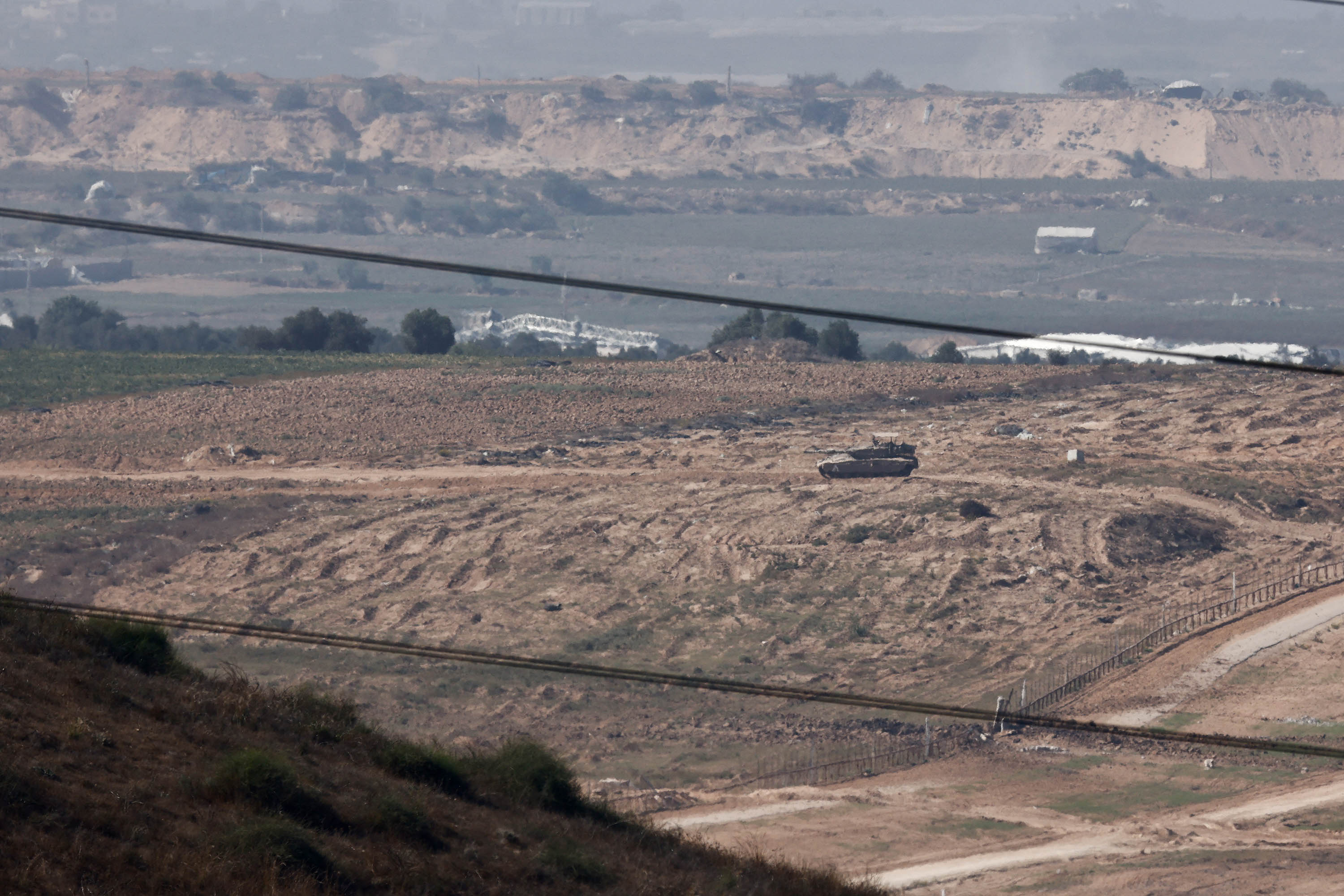 A tank manoeuvres from Israel into Gaza, as seen from Sderot, Israel, on November 6. 