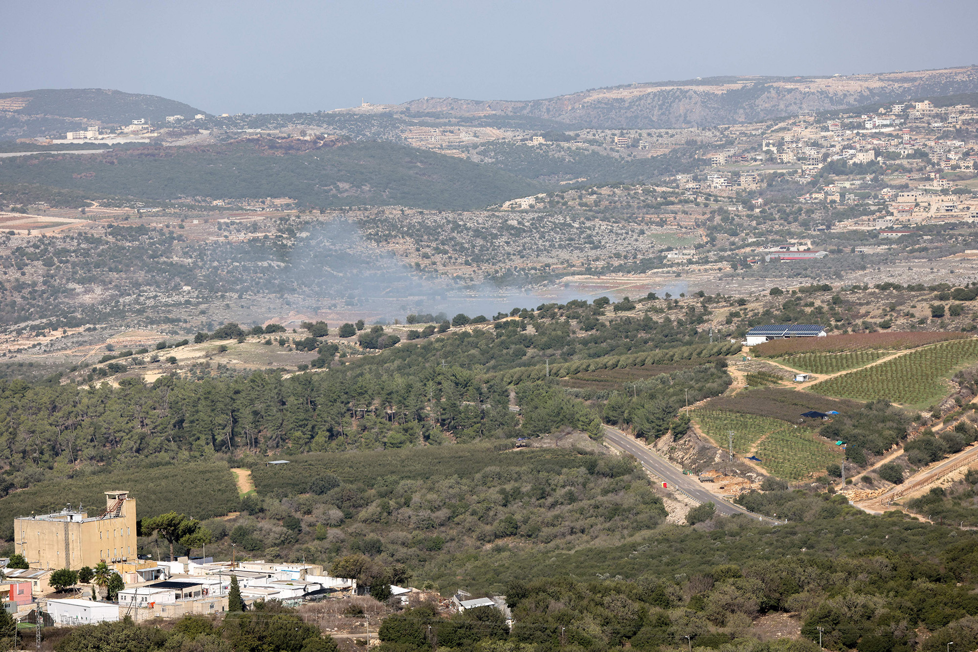 Smoke billows from an area targeted by Hezbollah militants on November 23, near Israel's border with Lebanon