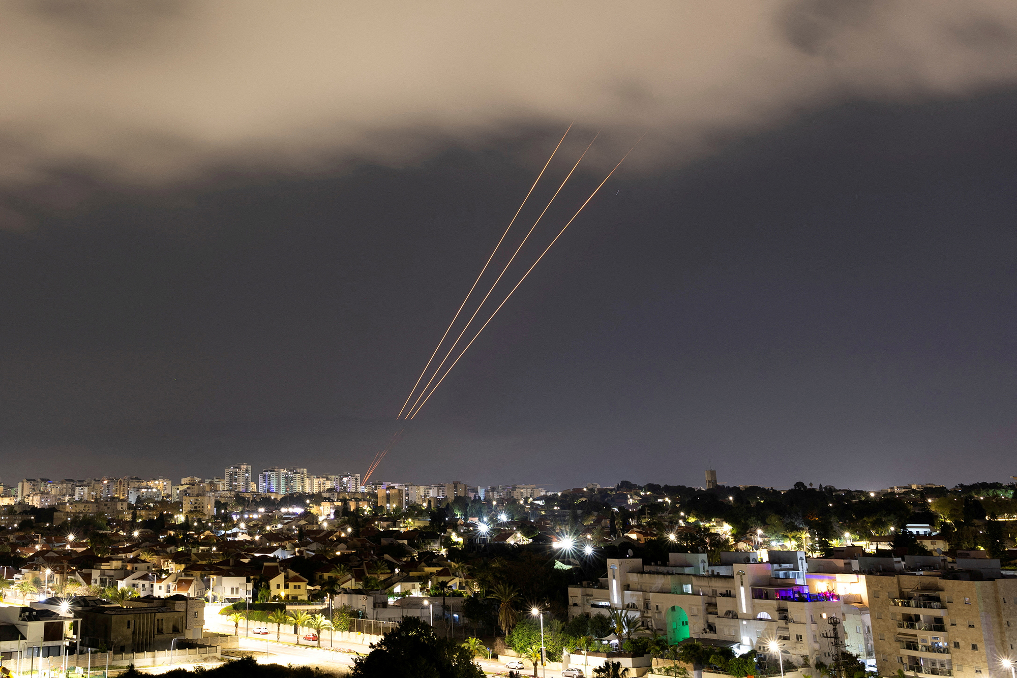 An anti-missile system operates after Iran launched drones and missiles towards Israel, as seen from Ashkelon, Israel, on April 14.