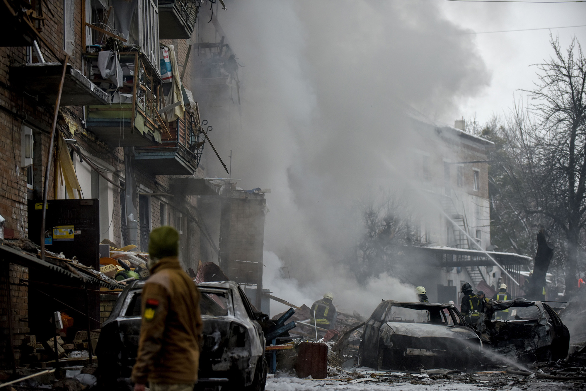 Emergency teams on the site where a Russian rocket hit a residential building in Vyshhorod, Kyiv, on November 23.