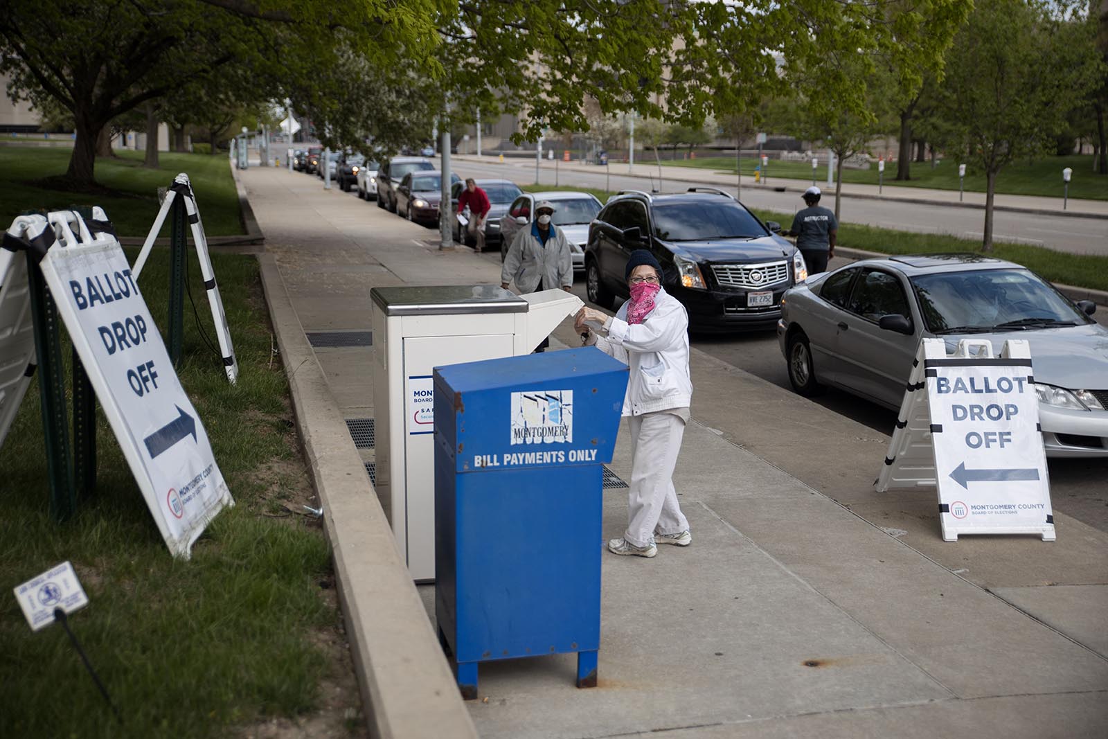 Ohio voters line up in their cars to drop off their ballots at the Board of Elections in Dayton, Ohio on April 28.