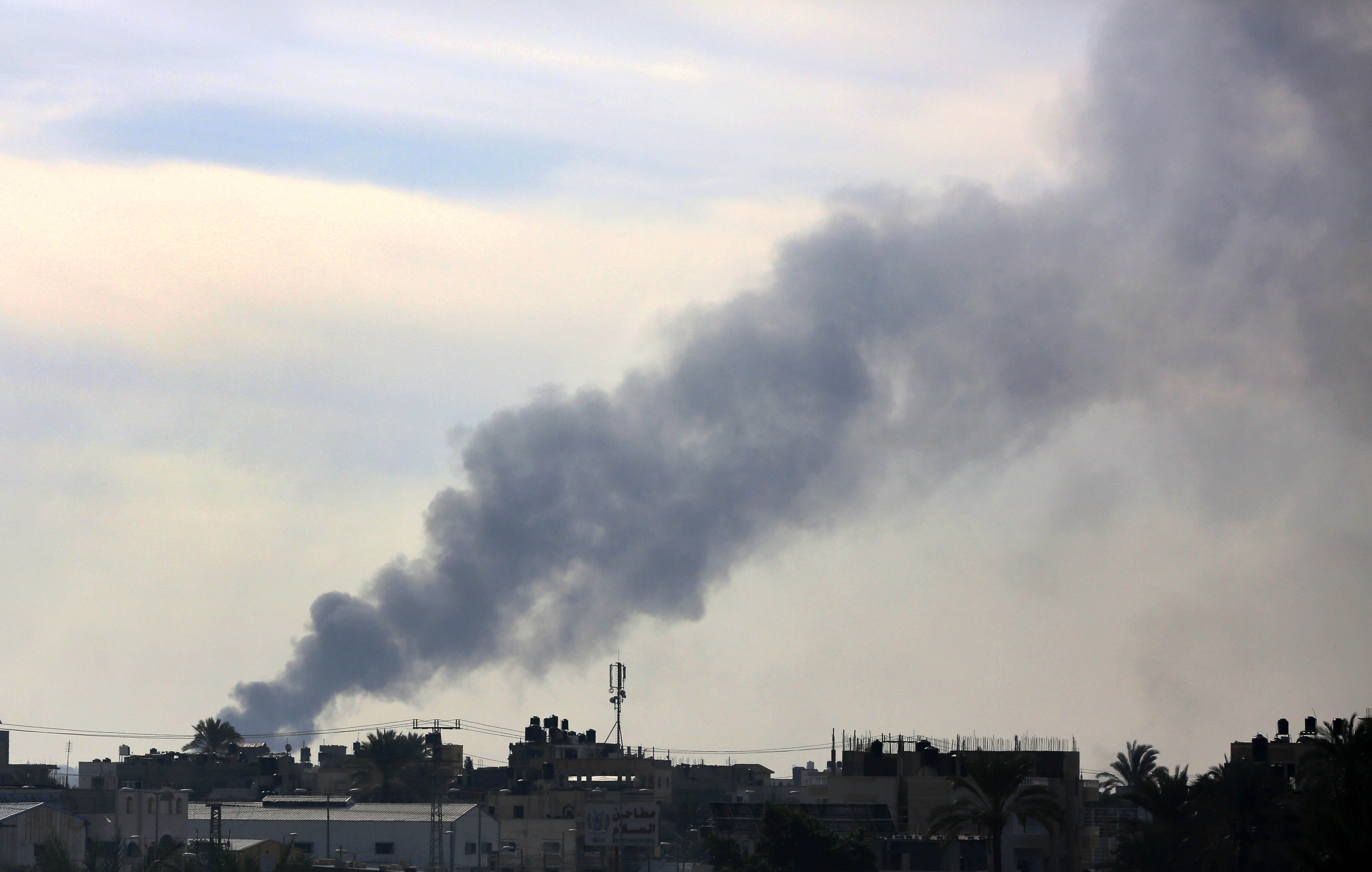 Smoke rises from an area hit during Israeli attacks in Deir al-Balah, Gaza, on December 20.