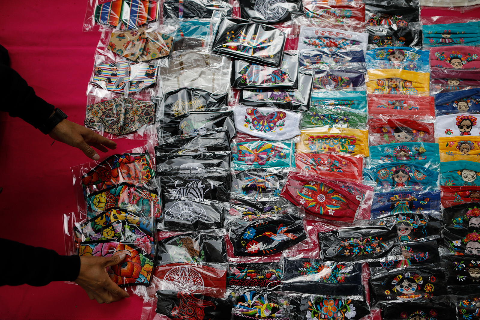 Face masks are laid out for sale in Mexico City, on Monday, August 17.