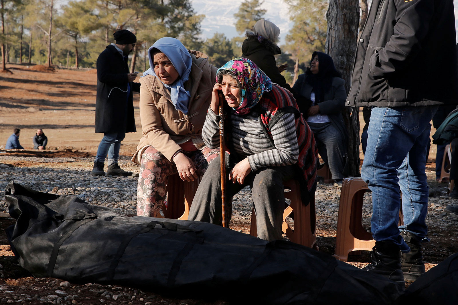 Women mourn for a relative at a cemetery for victims of the deadly earthquake in Kahramanmaras, Turkey, on February 9. 
