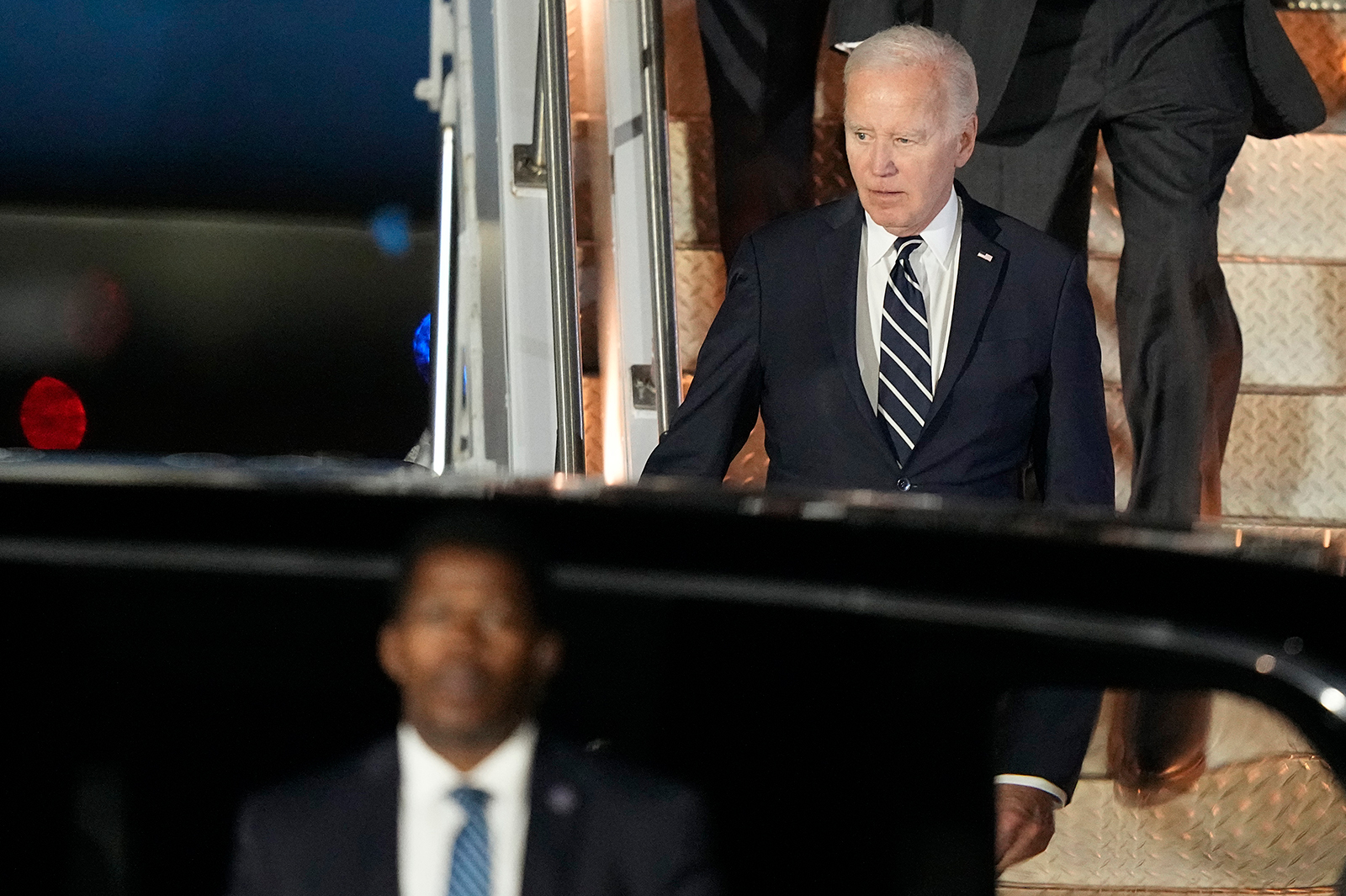 Joe Biden walks the stairs off of Air Force One after arriving at Love Field in Dallas, on January 8.