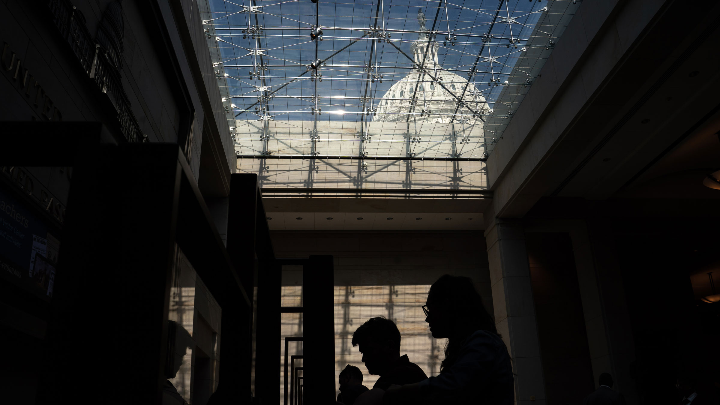People are silhouetted inside the US Capitol on Friday.