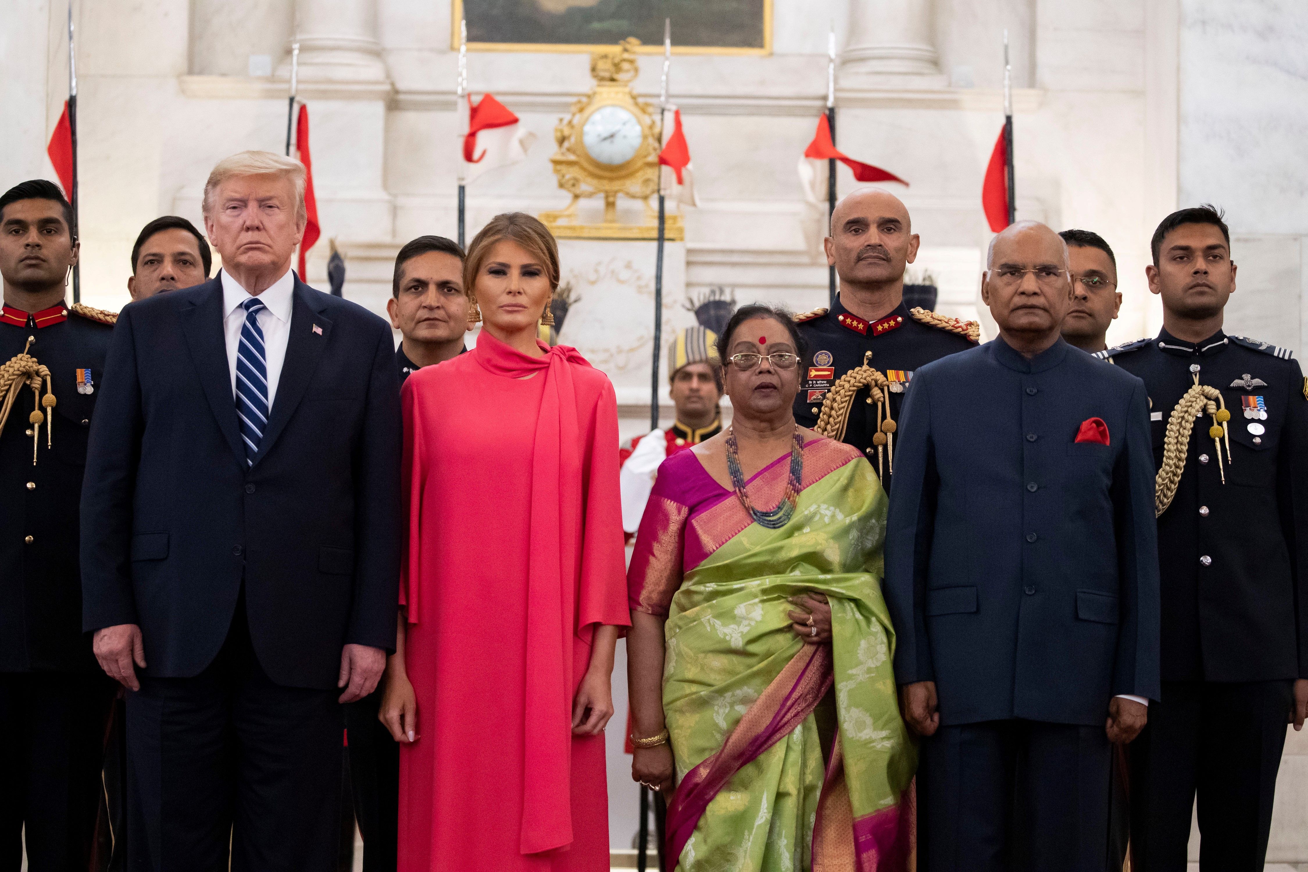 US President Donald Trump and the first lady stand with India's President Ram Nath Kovind and his wife Savita Kovind during a state banquet at the Presidential Palace in New Delhi on Tuesday. 