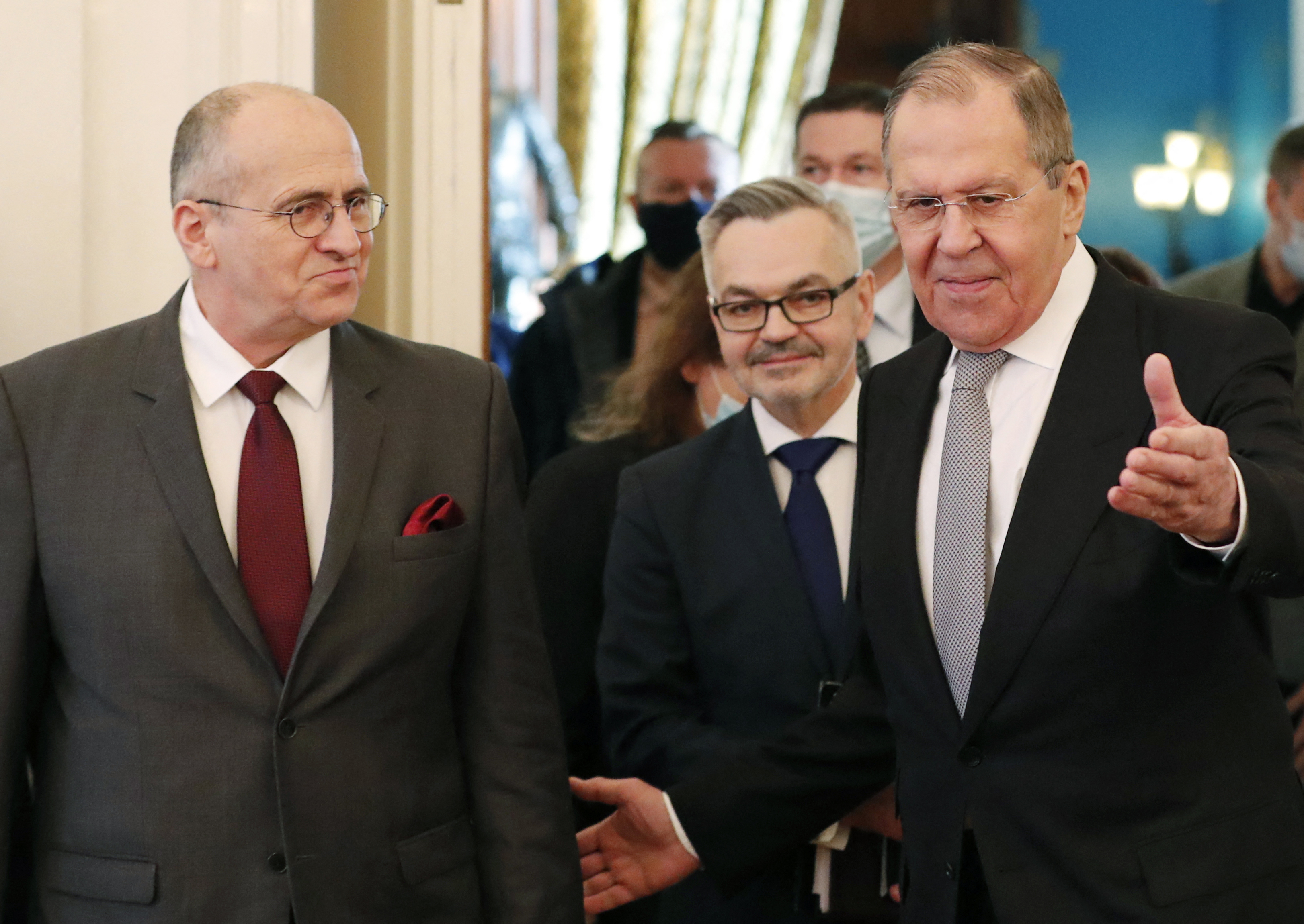 Russian Foreign Minister Sergei Lavrov, right, welcomes OSCE Chairman and Poland's Foreign Minister Zbigniew Rau during a meeting in Moscow on February 15.