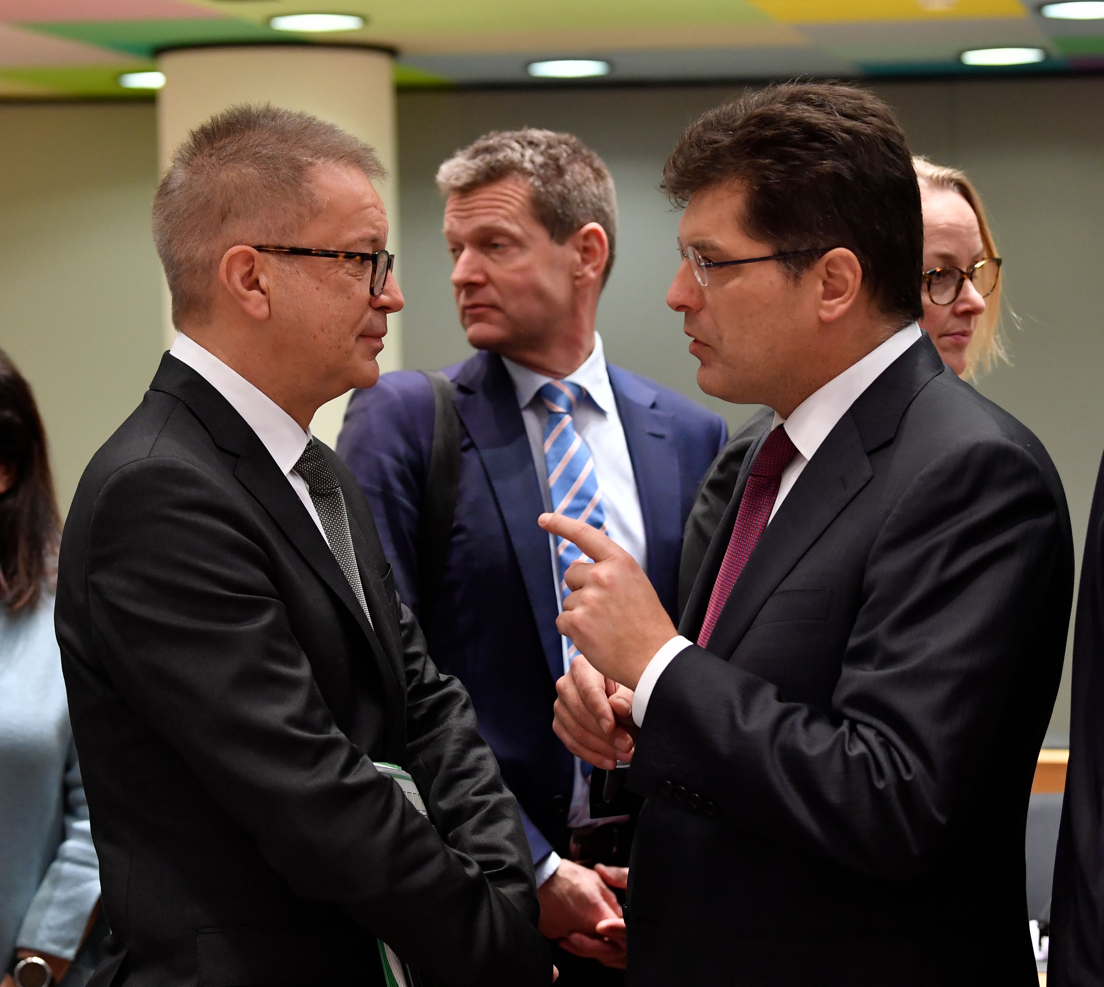 Austria's Minister for Social Affairs Rudolf Anschober, left, talks with European Commissioner for Crisis Management Janez Lenarcic during the Ministers of Health meeting on the coronavirus in Brussels on Thursday.