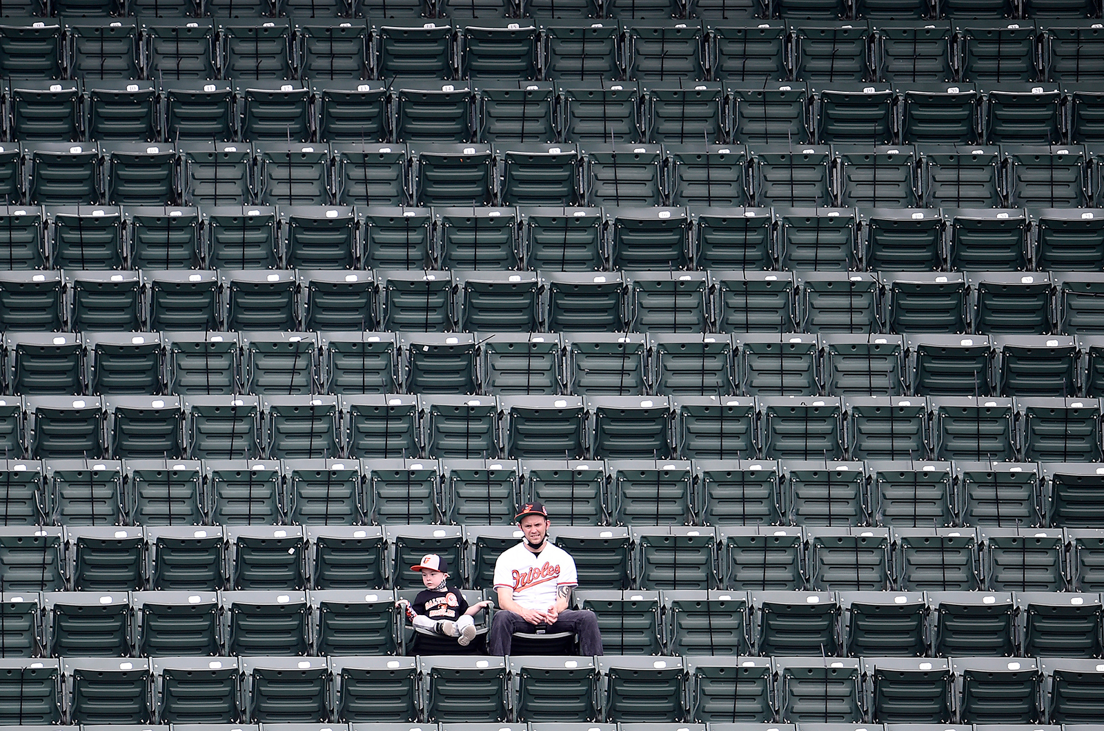 Fans look on during the second inning of the game between the Baltimore Orioles and the New York Yankees at Oriole Park at Camden Yards on April 29, in Baltimore. 