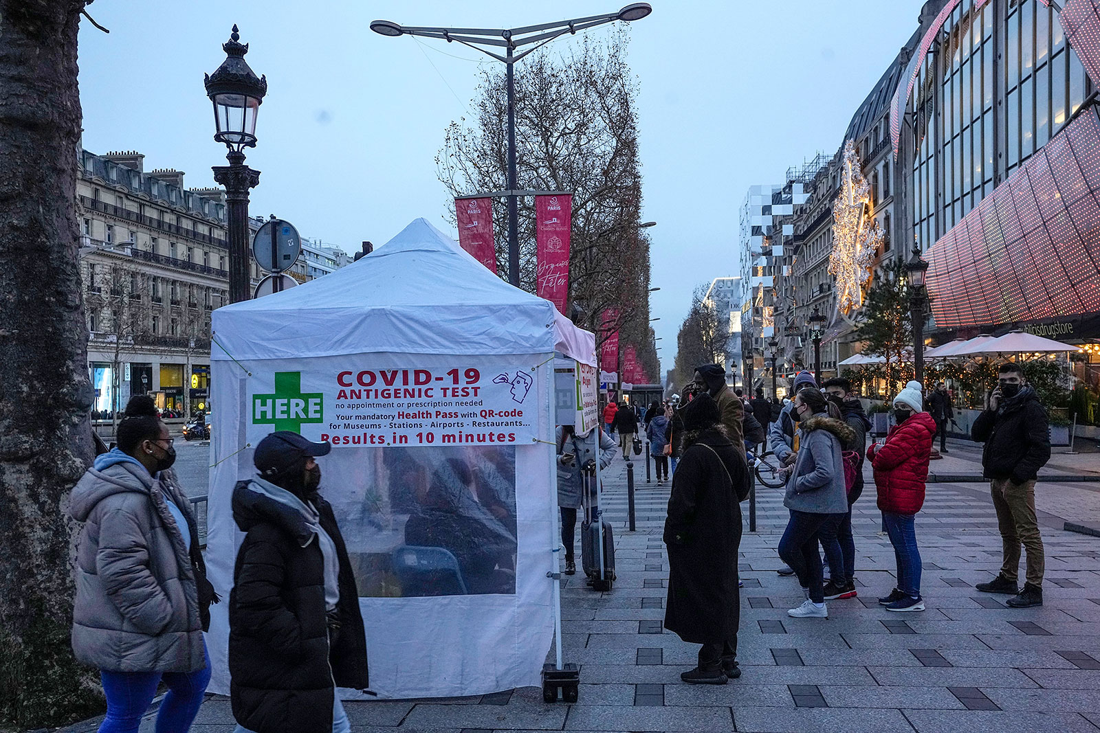 People line up to get tested for Covid-19 in Paris on December 24.