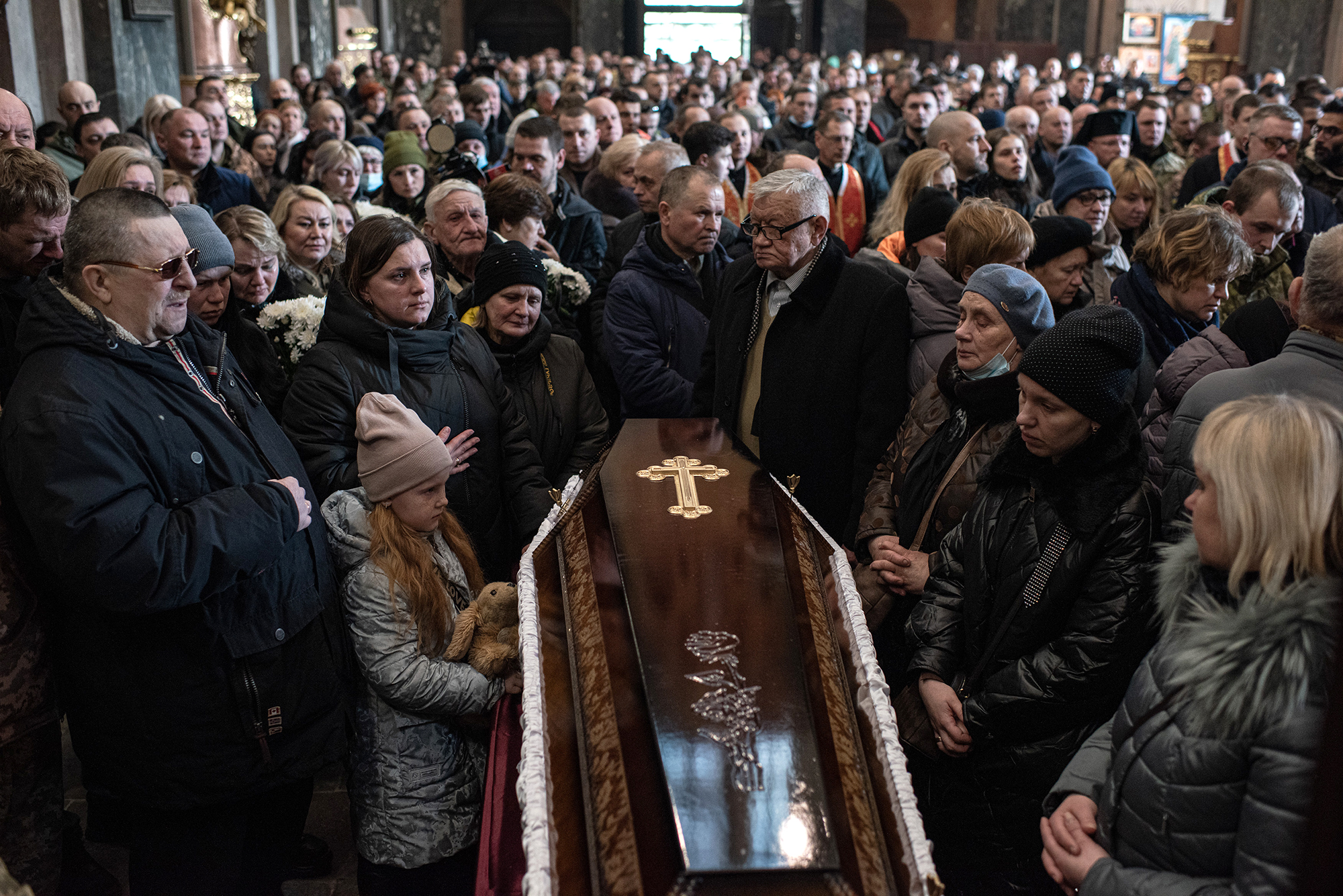 Relatives stand around the coffin of a Ukrainian soldier on March 15 in Lviv, Ukraine. 