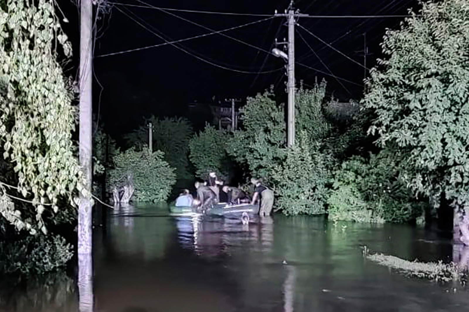 Rescuers evacuate people from a flooded area after a Russian missile hit a hydraulic structure in Kryvyi Rih on September 14.