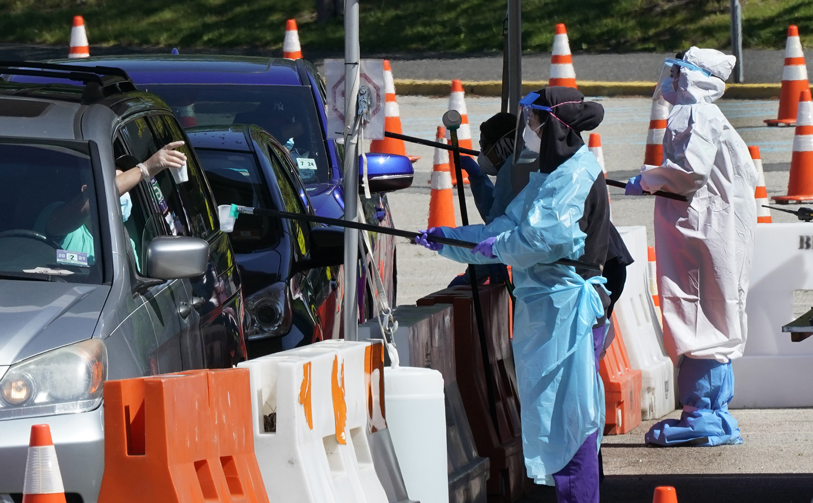 People line up in their cars at a drive-thru COVID-19 testing site at the Bergen Community College main campus, in Paramus, New Jersey, on Tuesday, May 12.