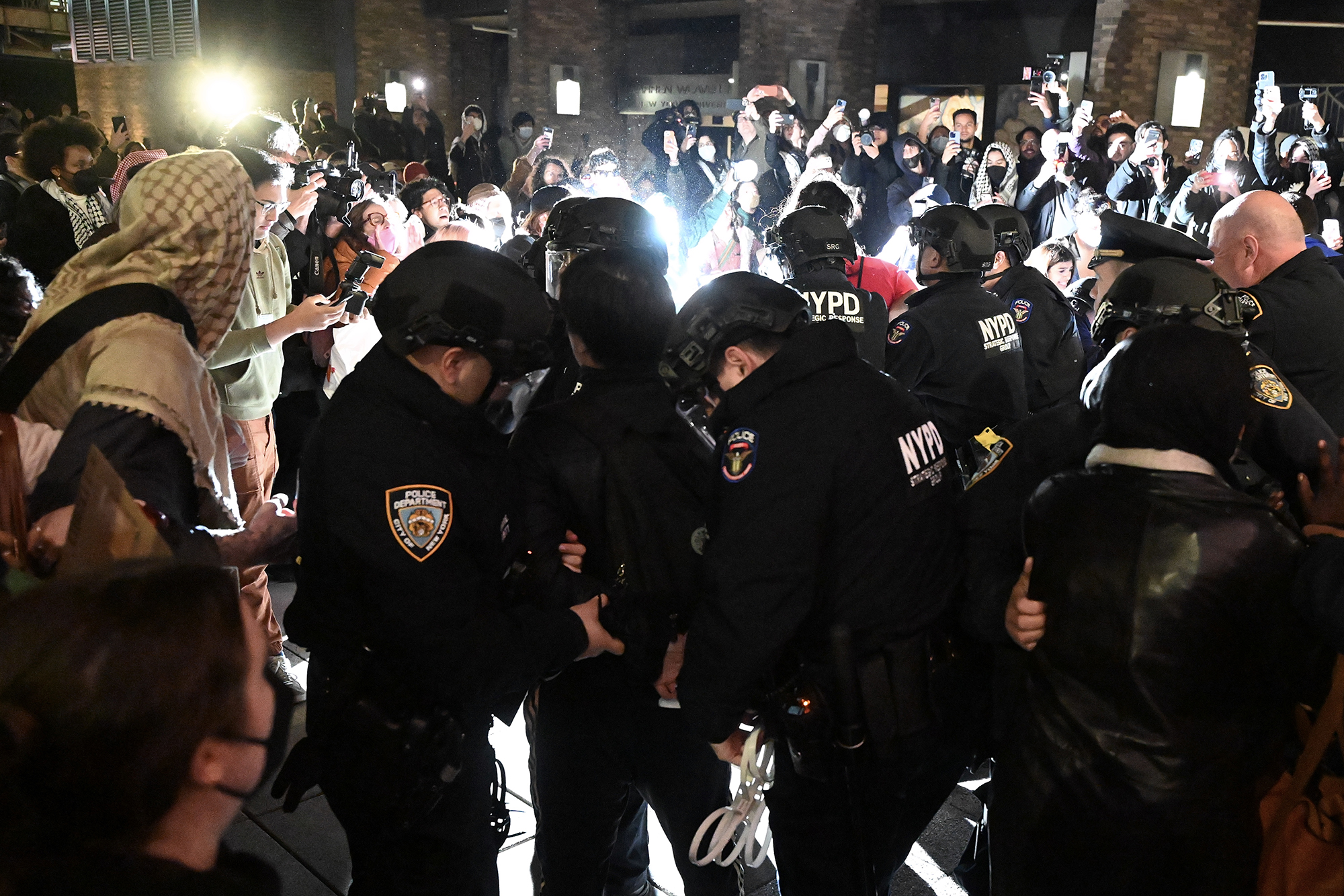 Police intervene and arrest more than 100 students at New York University (NYU) in New York on April 22 during a demonstration on campus in solidarity with the students at Columbia University and to oppose Israel's attacks on Gaza.