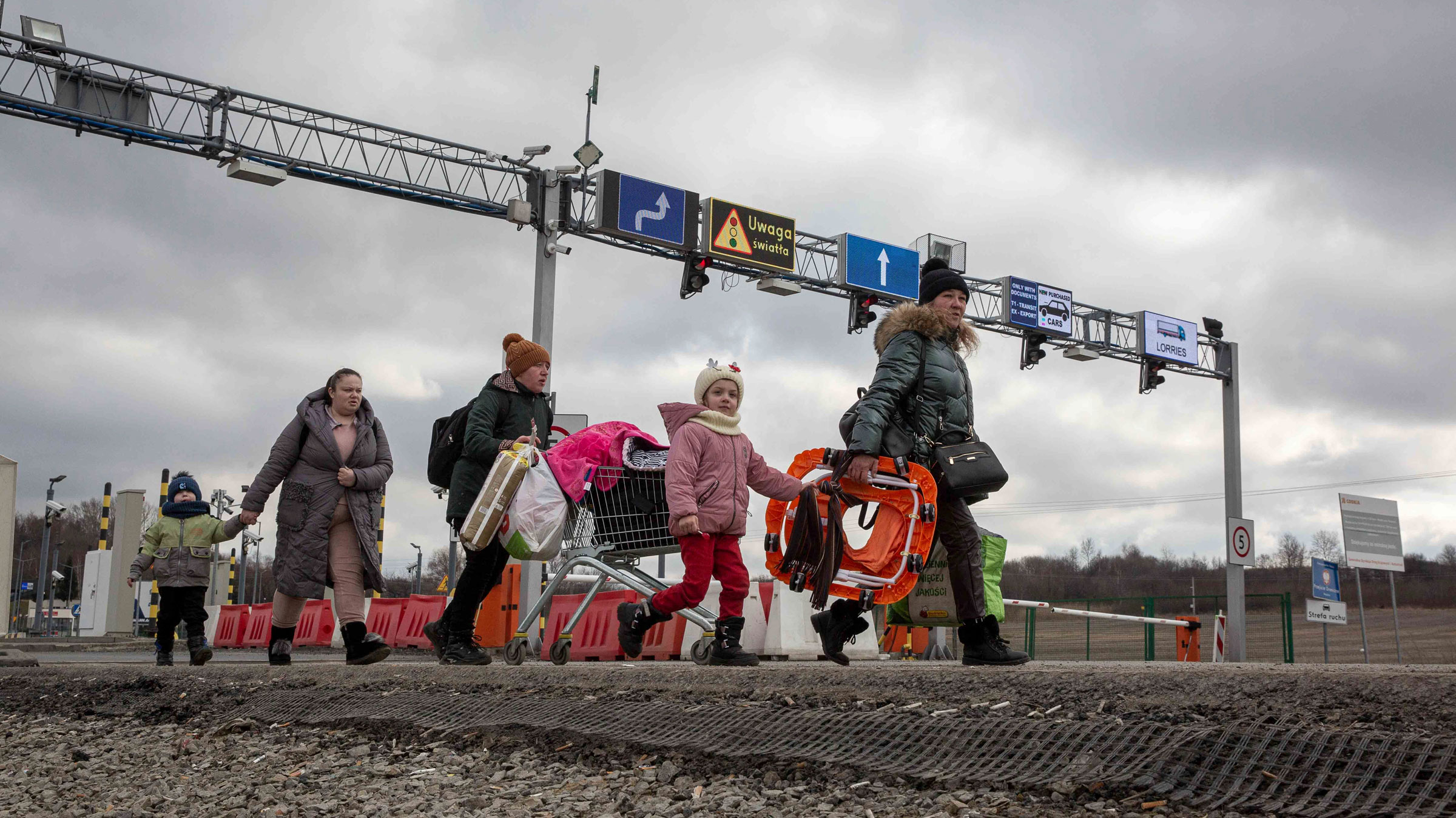 Refugees arrive at the Medyka border crossing in Poland on Monday.