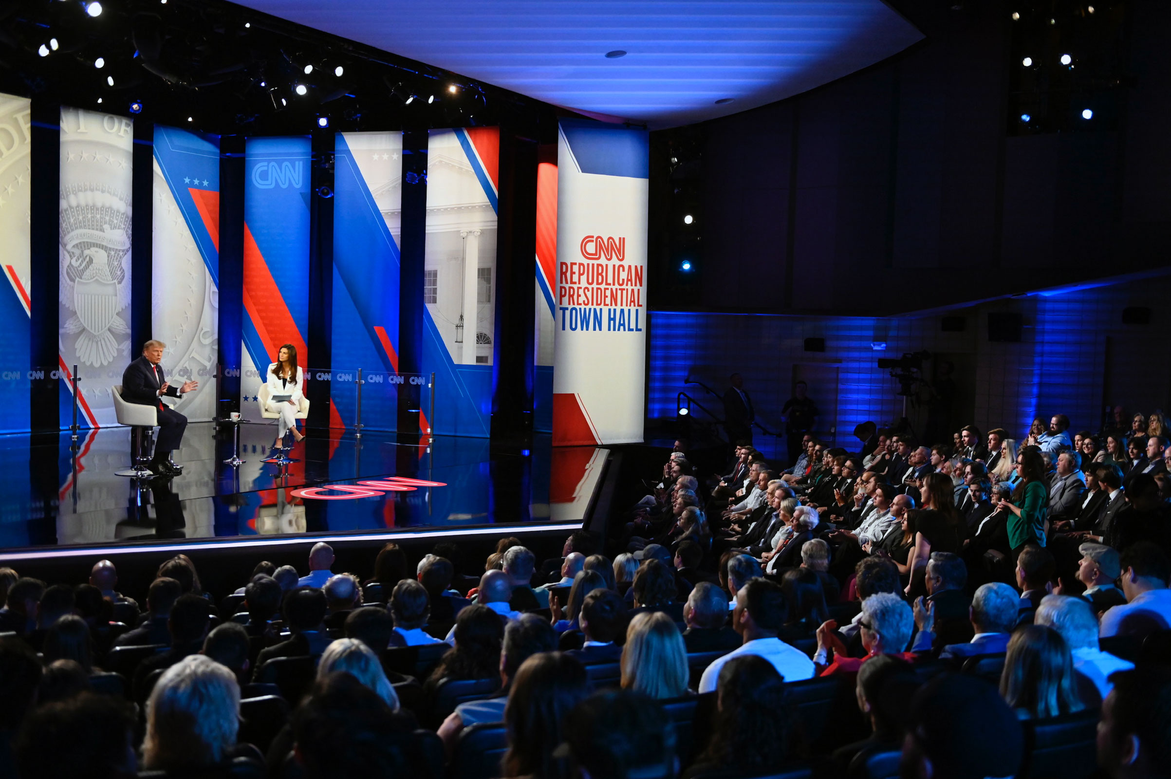 Audience members watch as President Donald Trump participates in a CNN Republican Town Hall moderated by CNN’s Kaitlan Collins at St. Anselm College in Manchester, New Hampshire, on Wednesday, May 10, 2023.