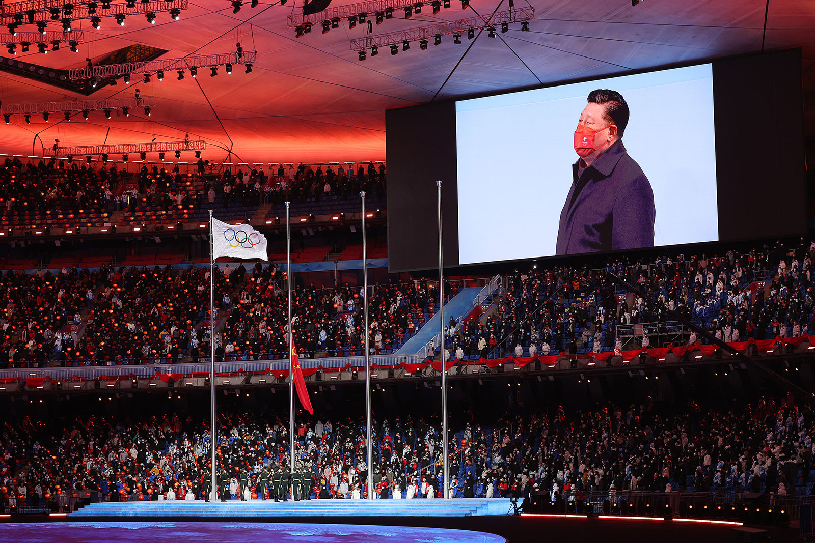 China's President Xi Jinping is seen on a screen during the Closing Ceremony on February 20.