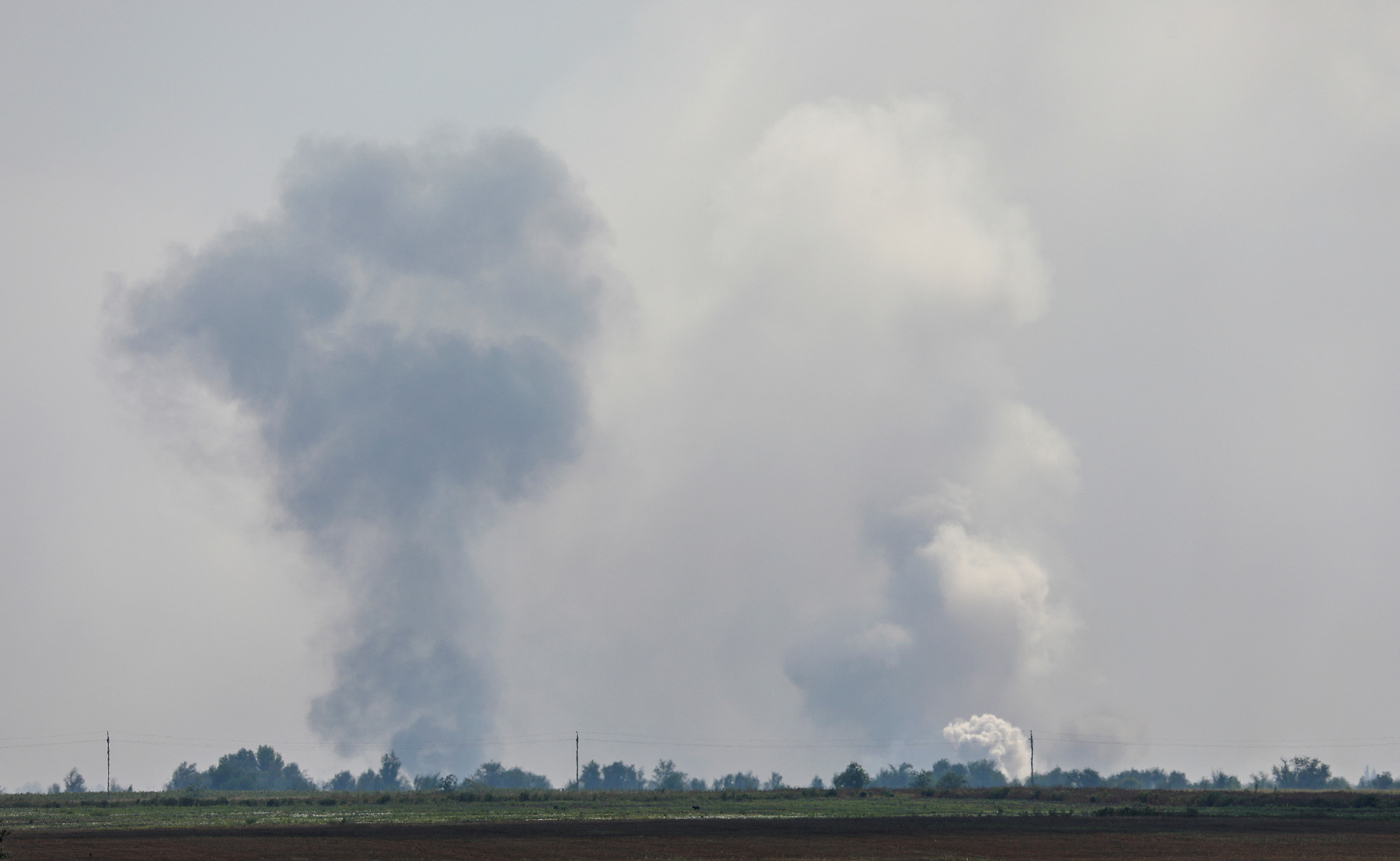 Smoke rises above the area following an alleged explosion in the village of Maiskoye in the Dzhankoi district, Crimea on August 16.