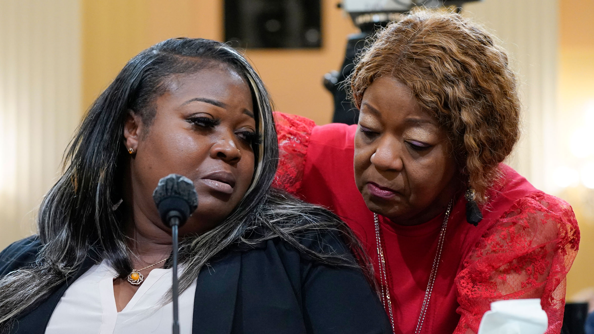 Wandrea "Shaye" Moss is comforted by her mother, Ruby Freeman, during Tuesday's hearing.