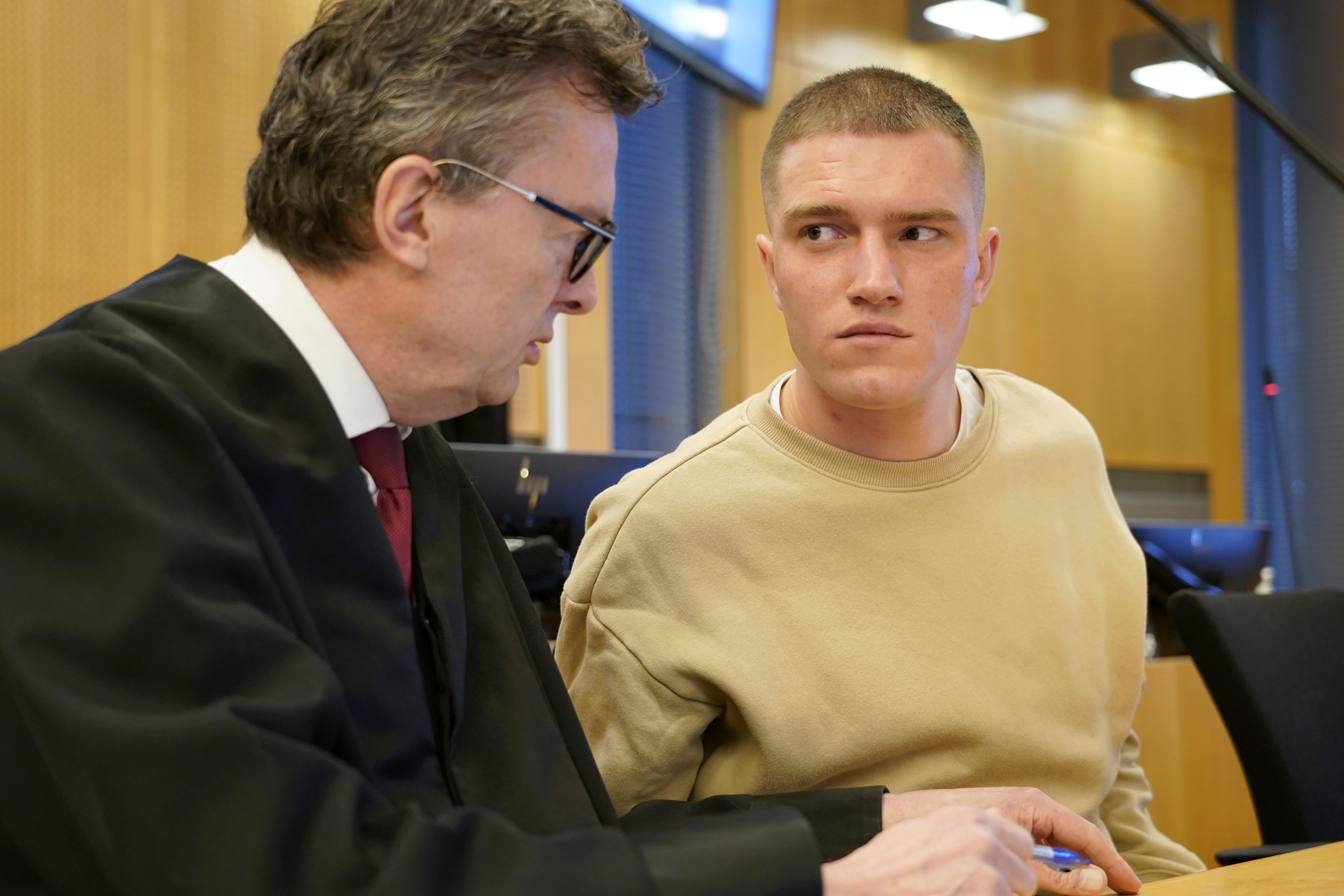 Former commander in the Wagner mercenary group Andrey Medvedev, pictured on the right, listens to his lawyer Brynjulf Risnes during a court hearing in Oslo, on April 25.
