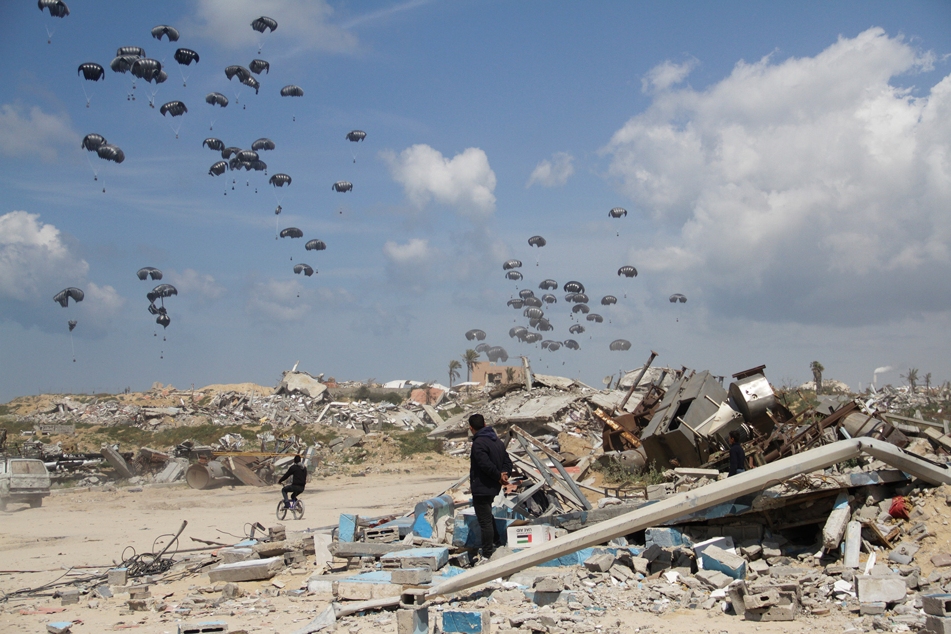 Humanitarian aid is airdropped to Palestinians over Gaza City, on Monday, March 25. 