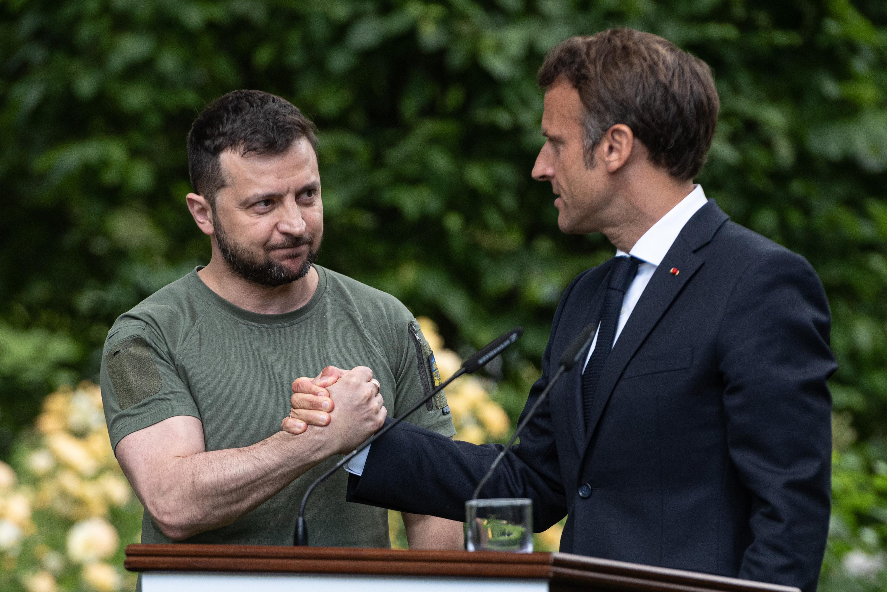 Ukrainian President Volodymyr Zelensky and French President Emmanuel Macron shake hands after a press conference on Thursday in Kyiv, Ukraine.