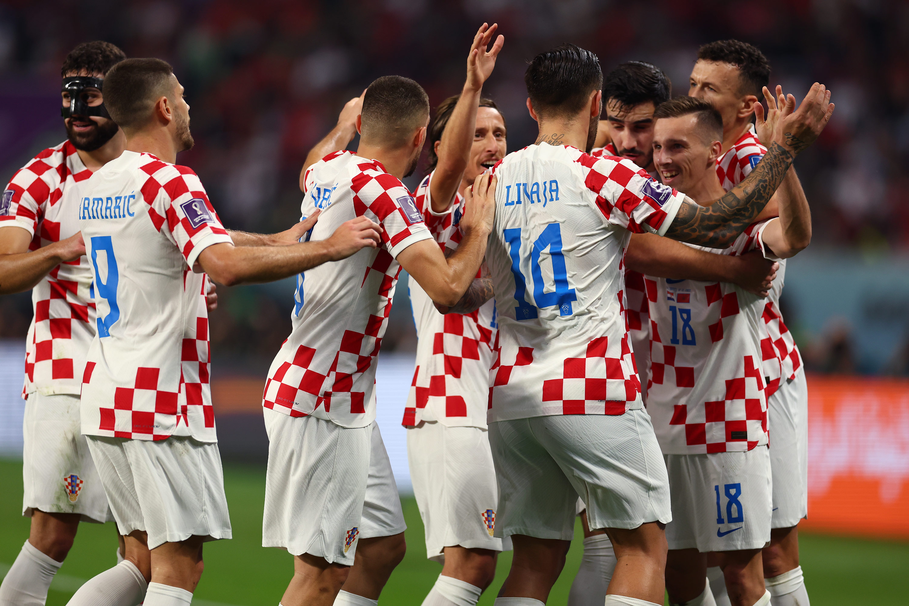 Croatia players celebrate their team’s second goal against Morocco on Saturday. 