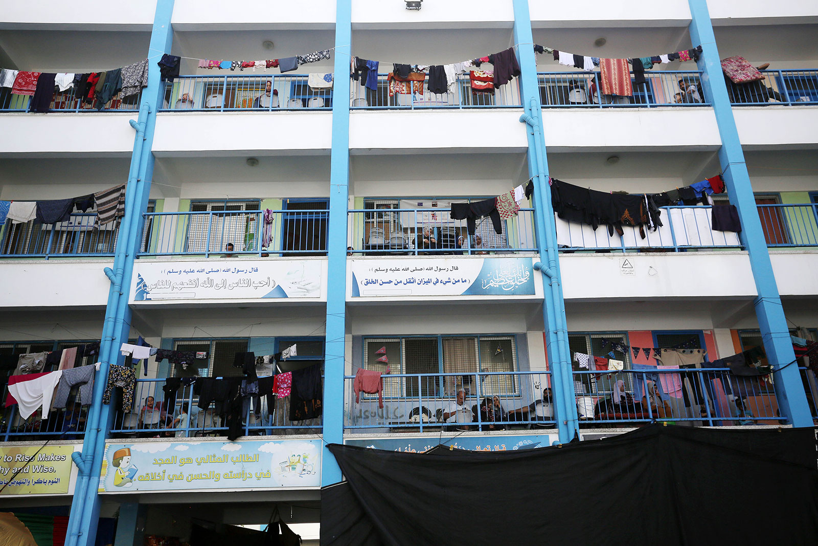 Palestinians take shelter at the UNRWA facility in Gaza City, on Thursday, October 12, 2023.