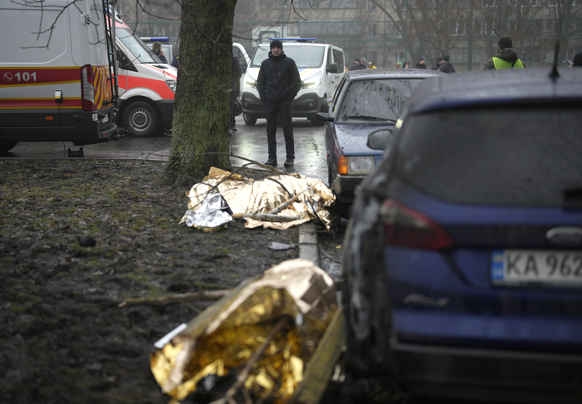 Covered bodies on the ground at the scene where a helicopter crashed in Brovary, on the outskirts of Kyiv, Ukraine, on January 18.