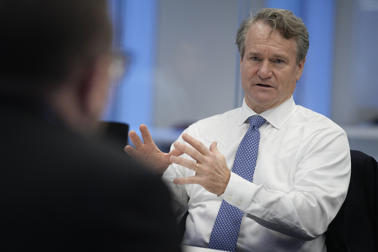 Brian Moynihan, CEO of Bank of America, talks with reporters at Associated Press headquarters in New York in November 2022. 