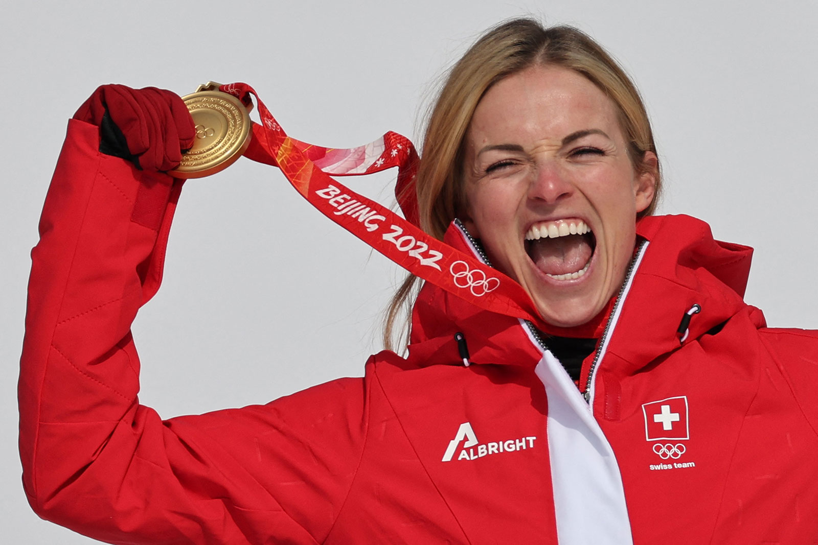 Switzerland's Lara Gut-Behrami celebrates on the podium with her gold medal for winning the women's super-G on Feb. 11