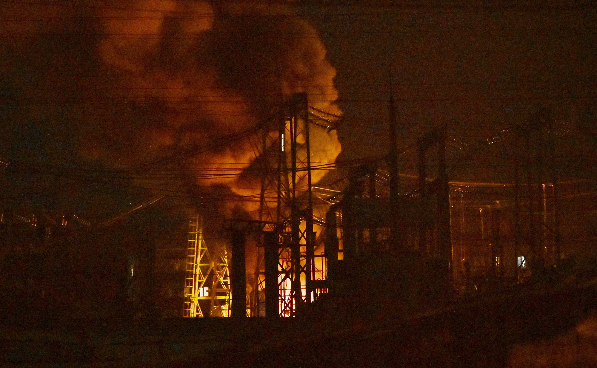 Critical power infrastructure burns after a drone attack in Kyiv, Ukraine, on December 19.