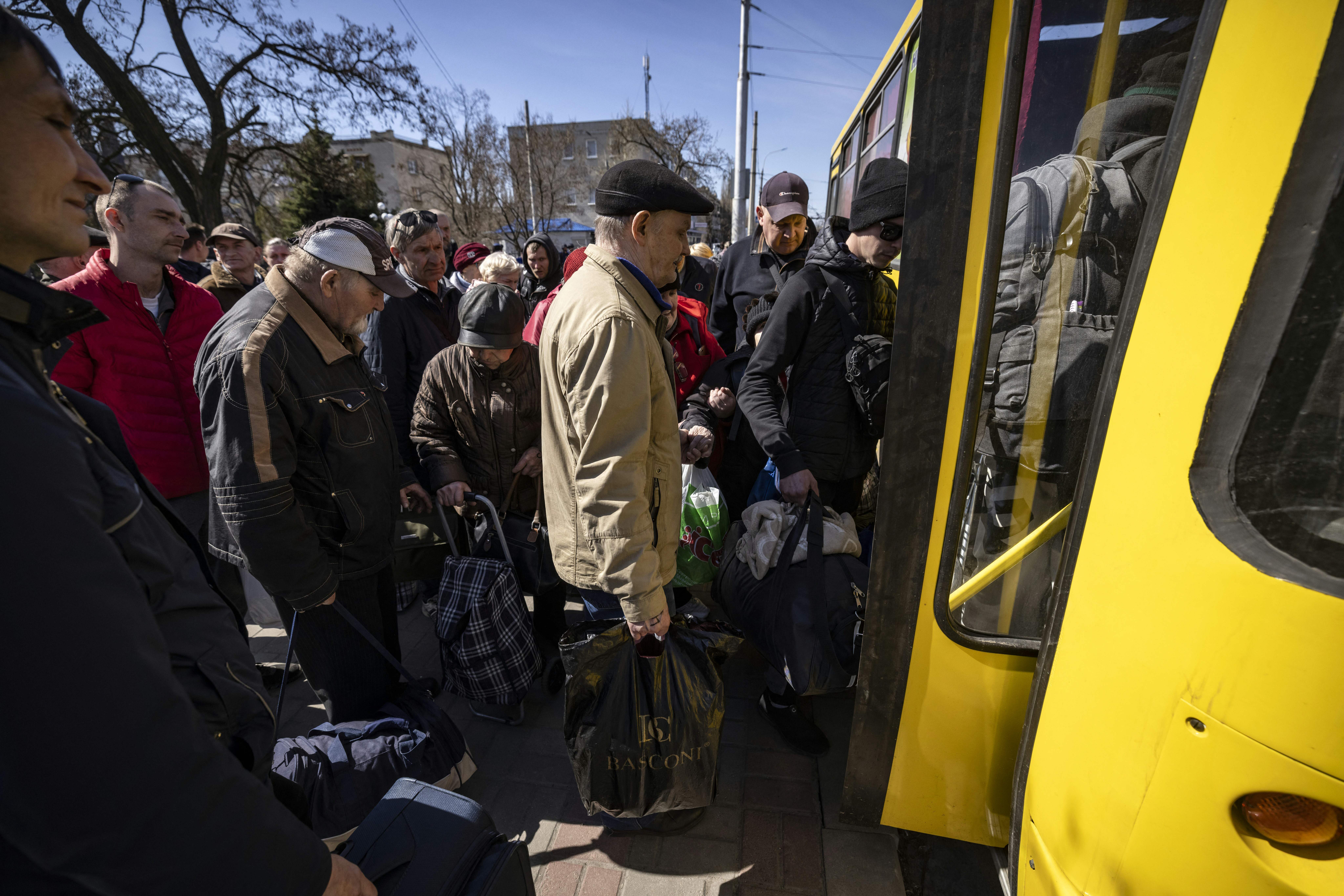 People board a bus in Severodonetsk as they flee the city in the Donbas region of Ukraine on April 7. 