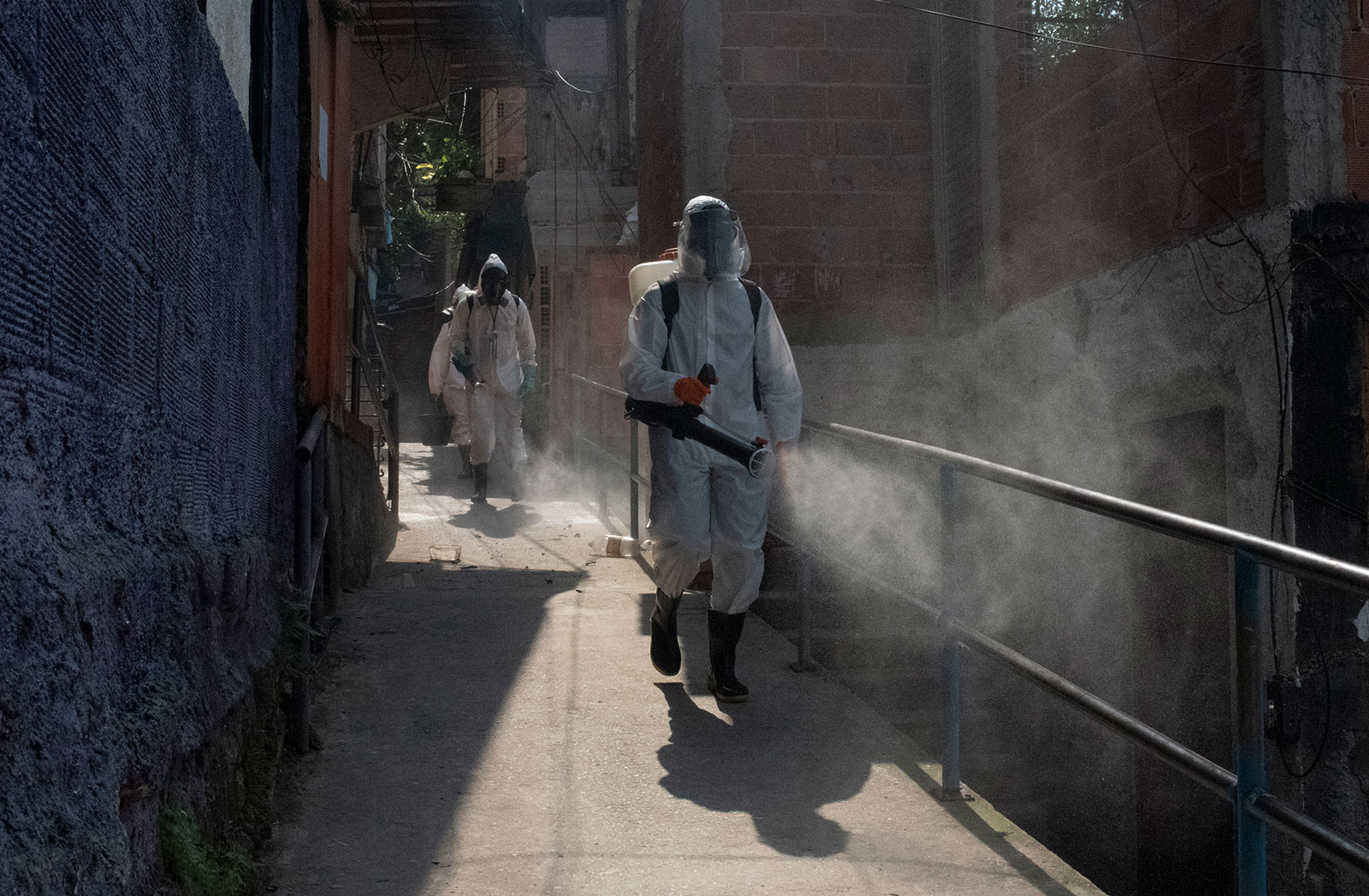 Workers disinfect a walkway in Rio de Janeiro, Brazil, on Sunday, October 4.