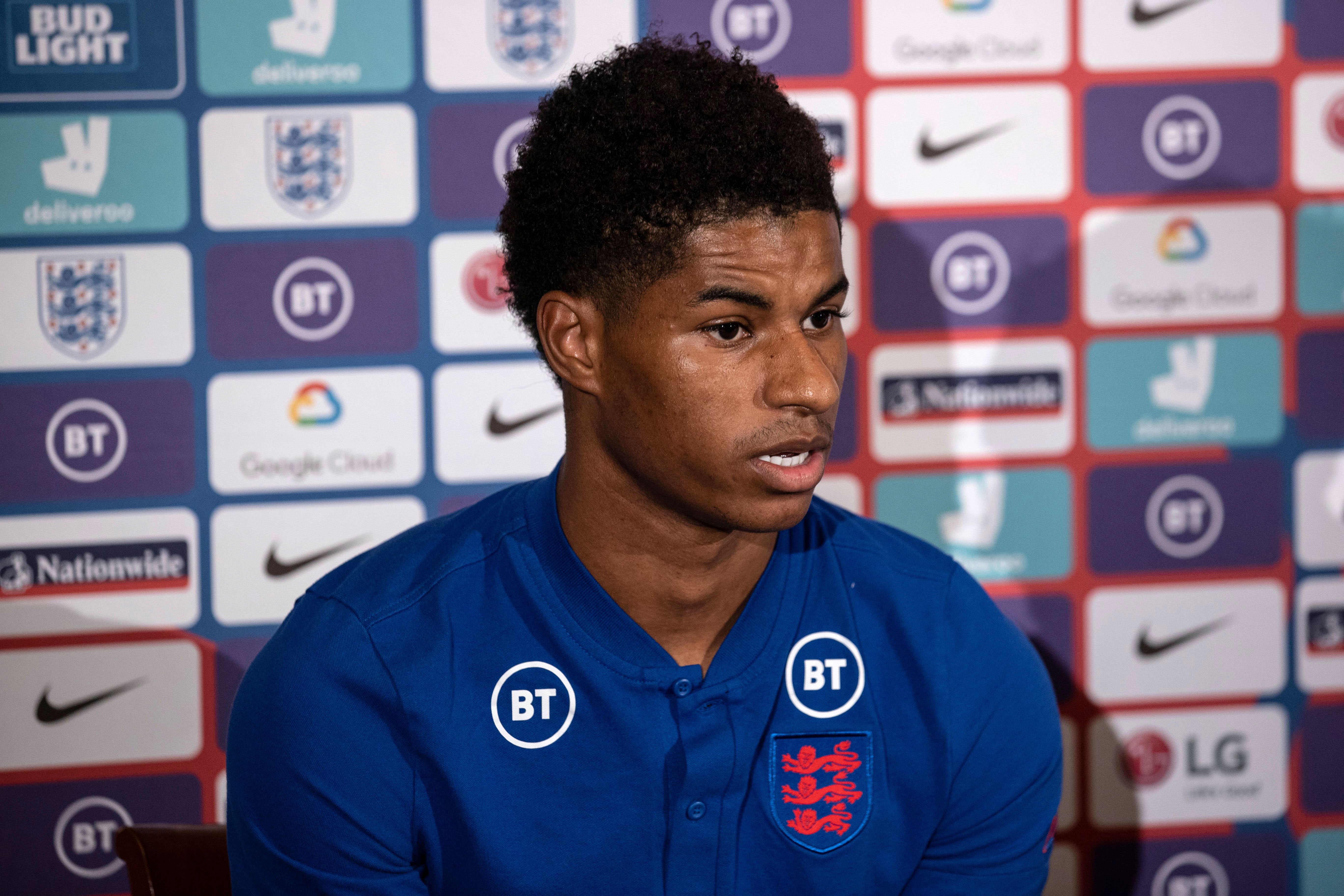 England and Manchester United striker Marcus Rashford speaks at a press conference in Surrey, England, on October 13.