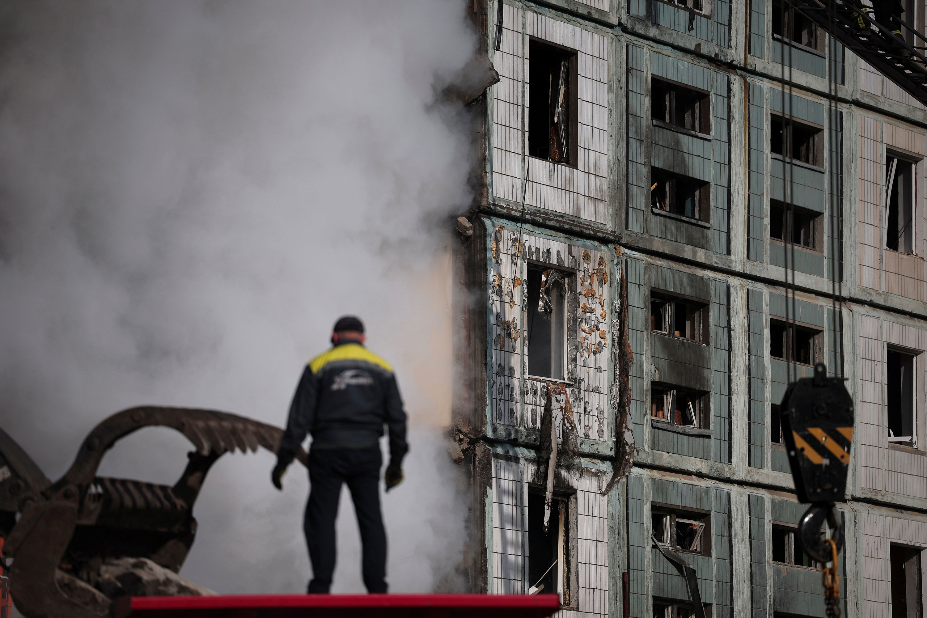 A rescuer observes damage in Uman, Ukraine on Friday.