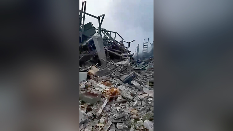 Destroyed buildings seen in the video footage.