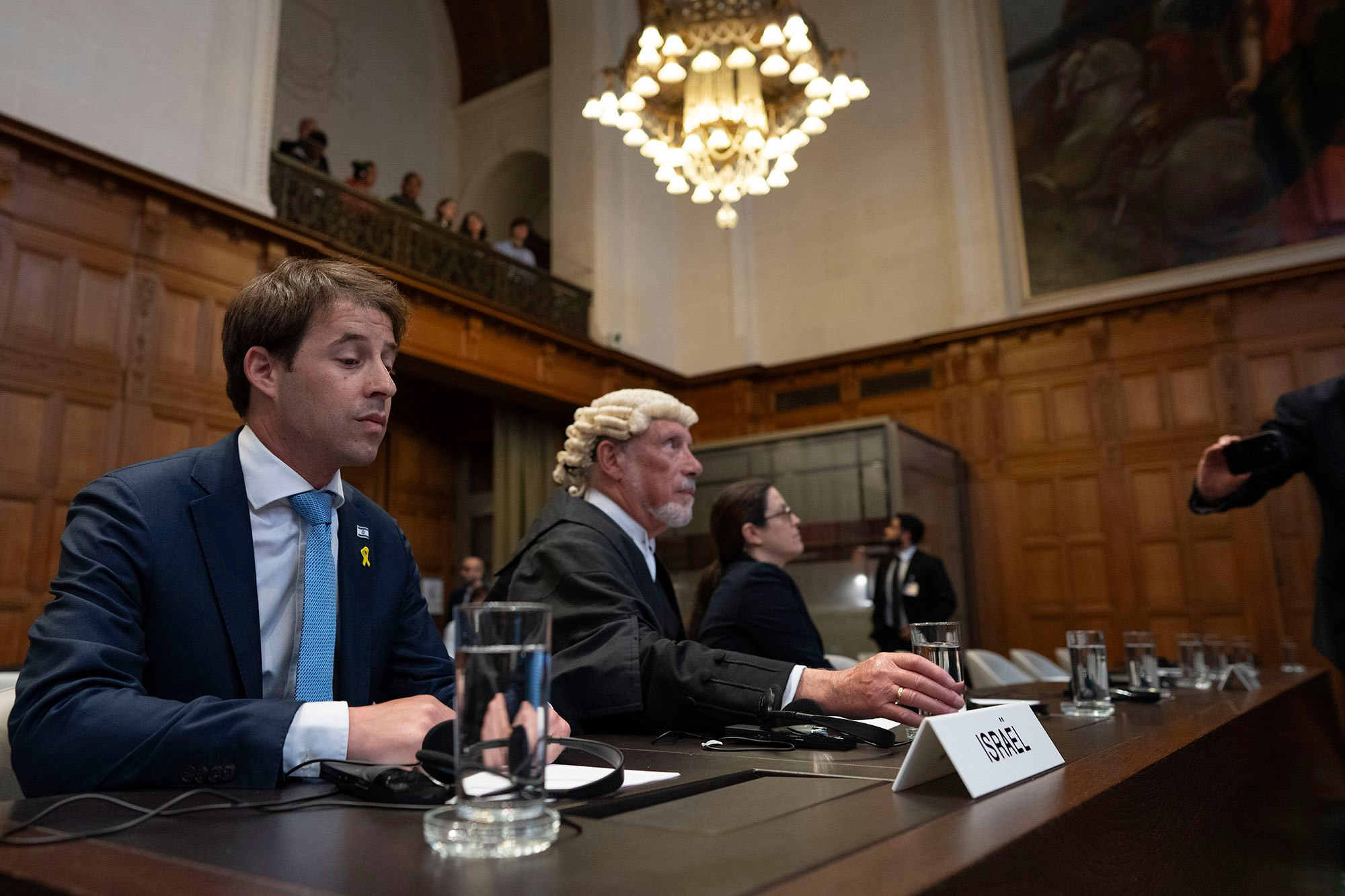 Israel legal team, with Yaron Wax, Malcolm Shaw and Avigail Frisch Ben Avraham, wait for judges to enter the International Court of Justice in The Hague, Netherlands on Friday.