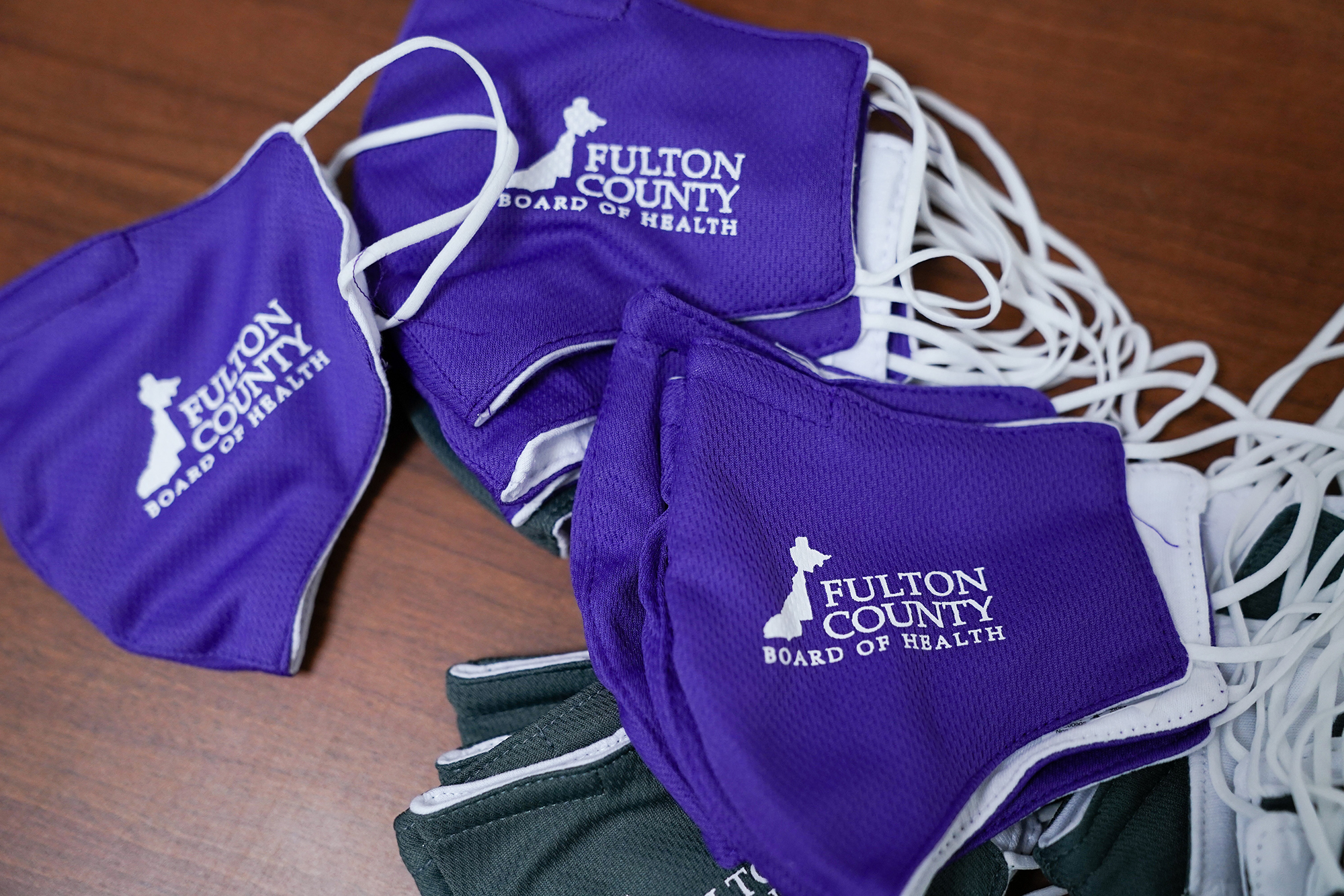 "Fulton County Board of Health" masks on a table at a polling location for the 2020 Presidential election in College Park, Georgia, U.S., on Tuesday, Nov. 3, 2020. 