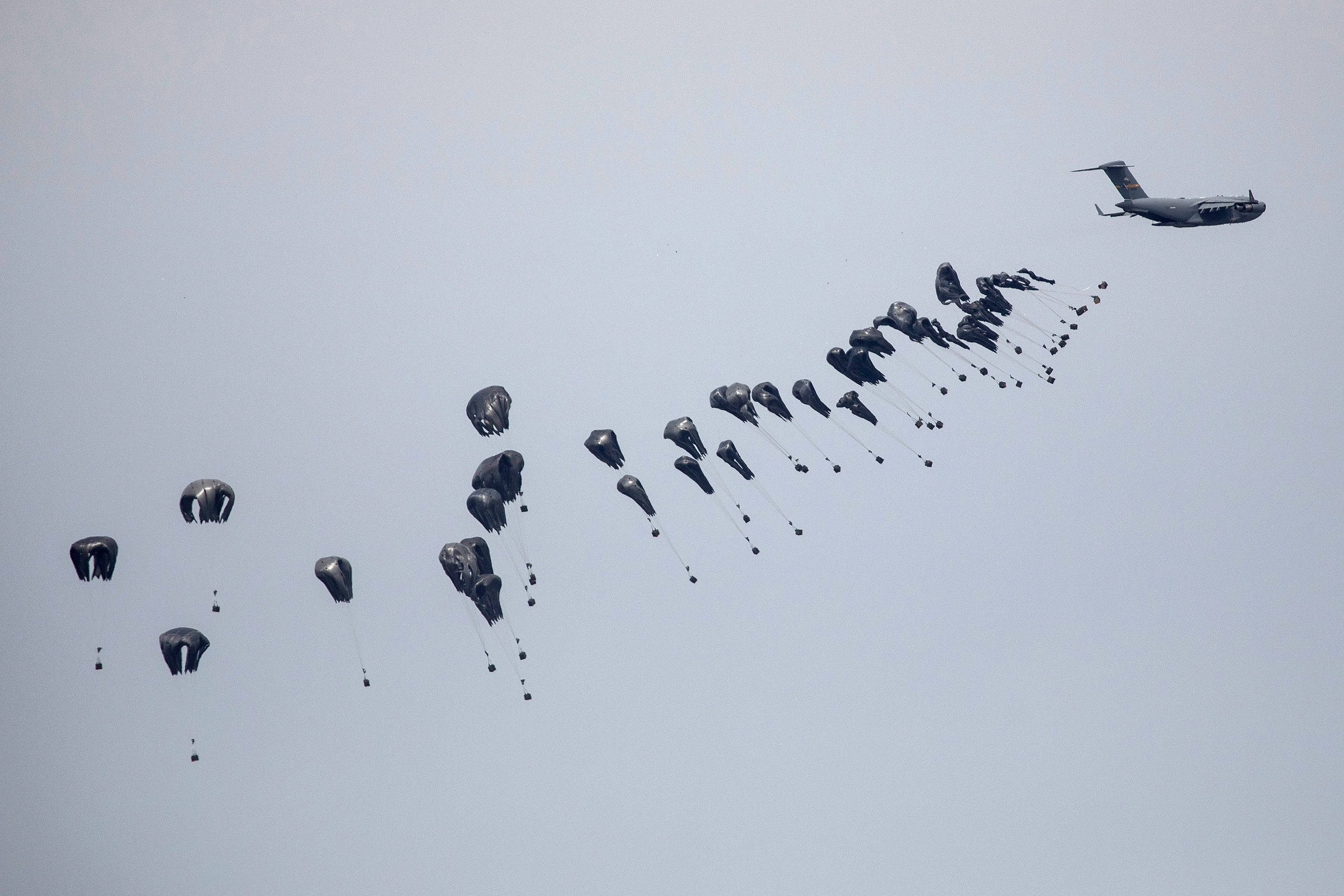 The US Air Force drops humanitarian aid into Gaza, as seen from southern Israel, on March 17. 